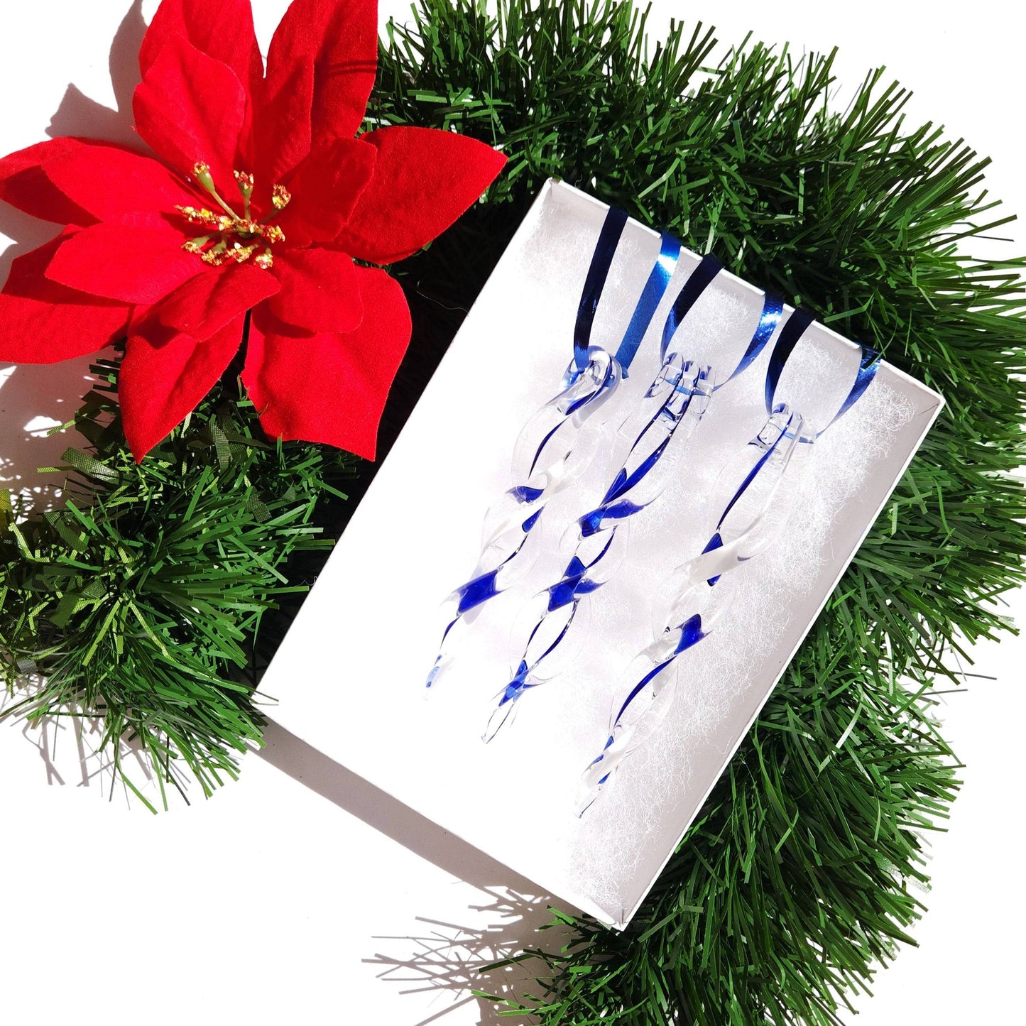 Gift box with three blue handmade glass Christmas icicles, ideal for holiday tree decorations or seasonal gift giving.