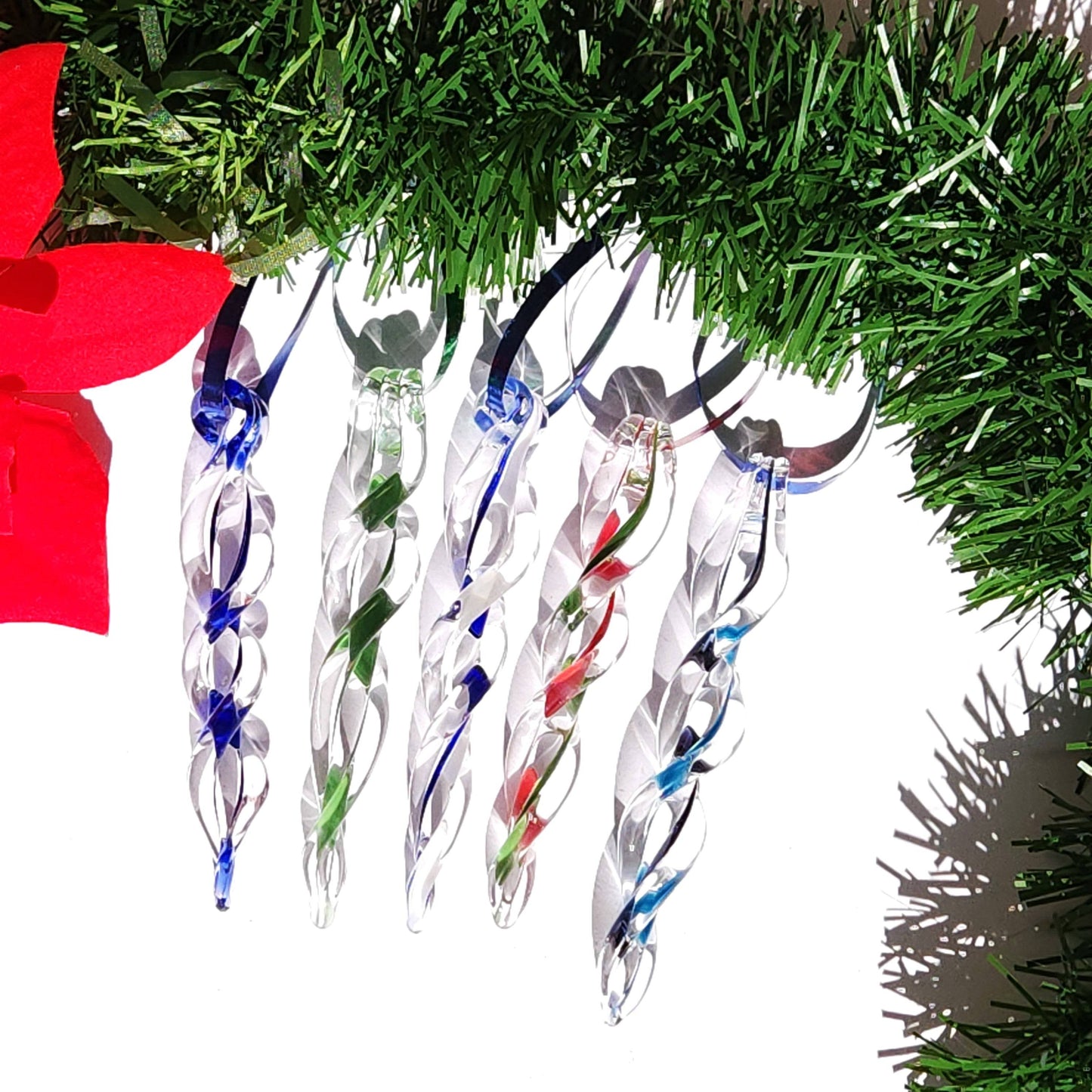 Set of five handmade glass Christmas ornaments with twisted icicle design in blue, green, and red, perfect for holiday home decor and gifts.