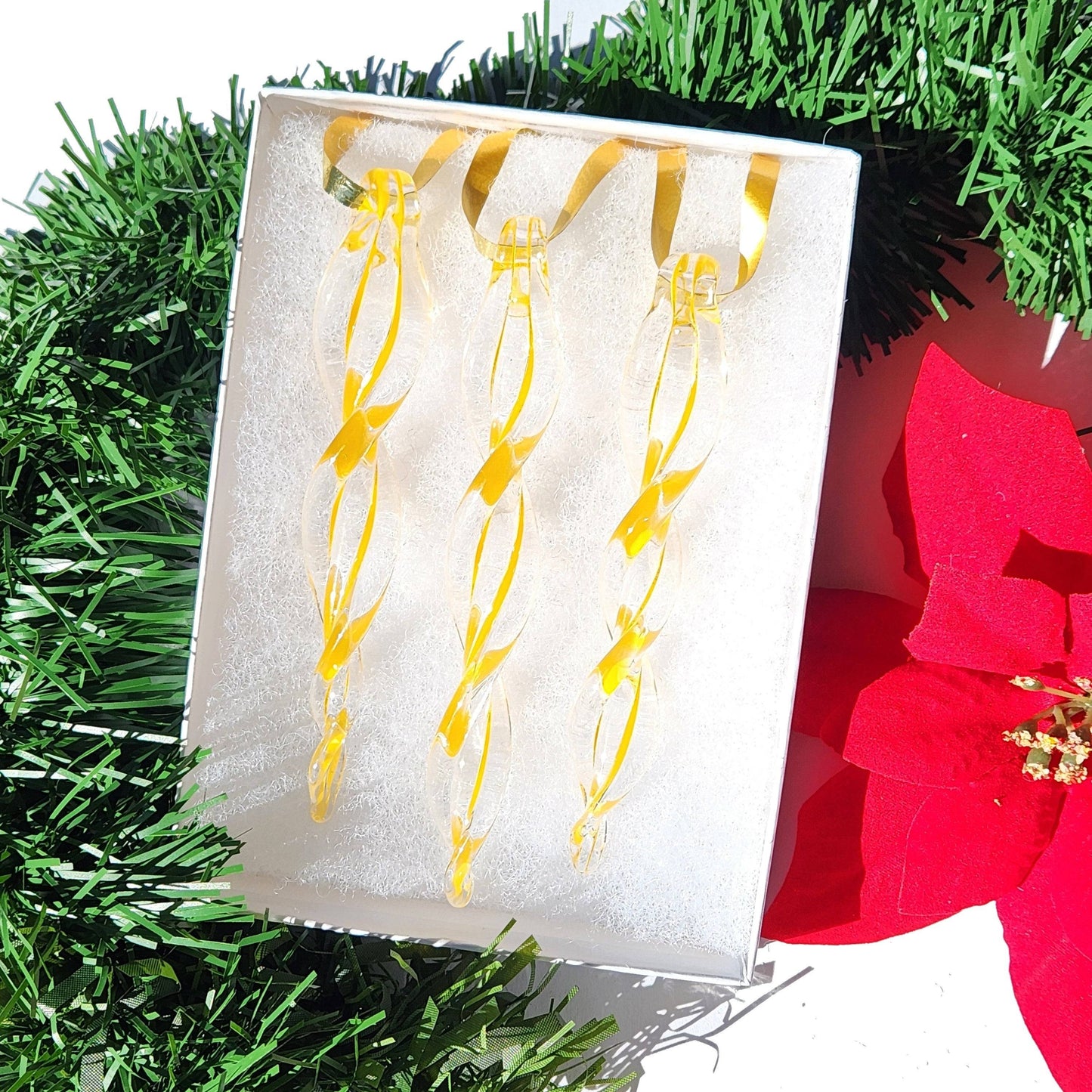 Box of three yellow handmade glass Christmas ornaments with ribbon hangers, perfect for seasonal home decor and gift ideas.
