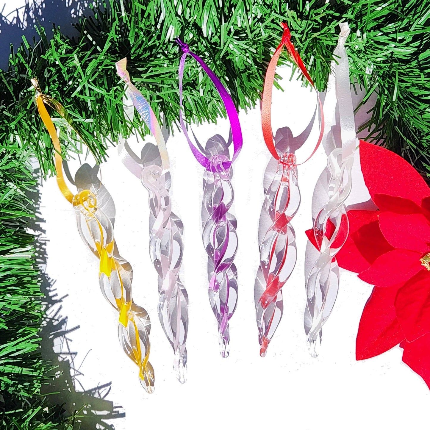 Five pastel-colored handmade glass icicle ornaments with ribbon hangers, perfect for whimsical holiday decorating and gifting.