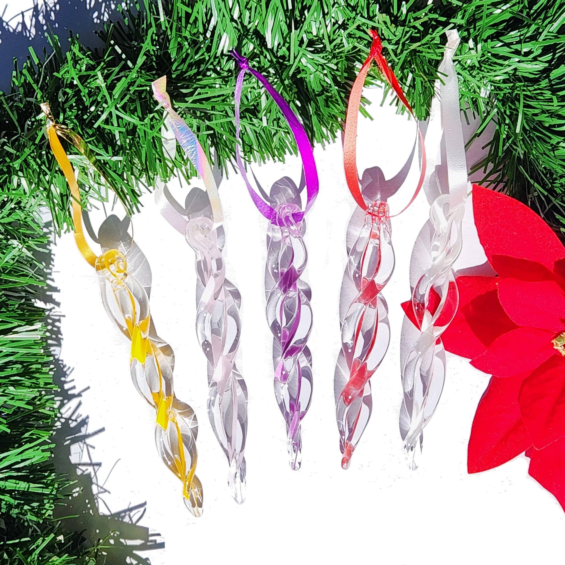 Five pastel-colored handmade glass icicle ornaments with ribbon hangers, perfect for whimsical holiday decorating and gifting.