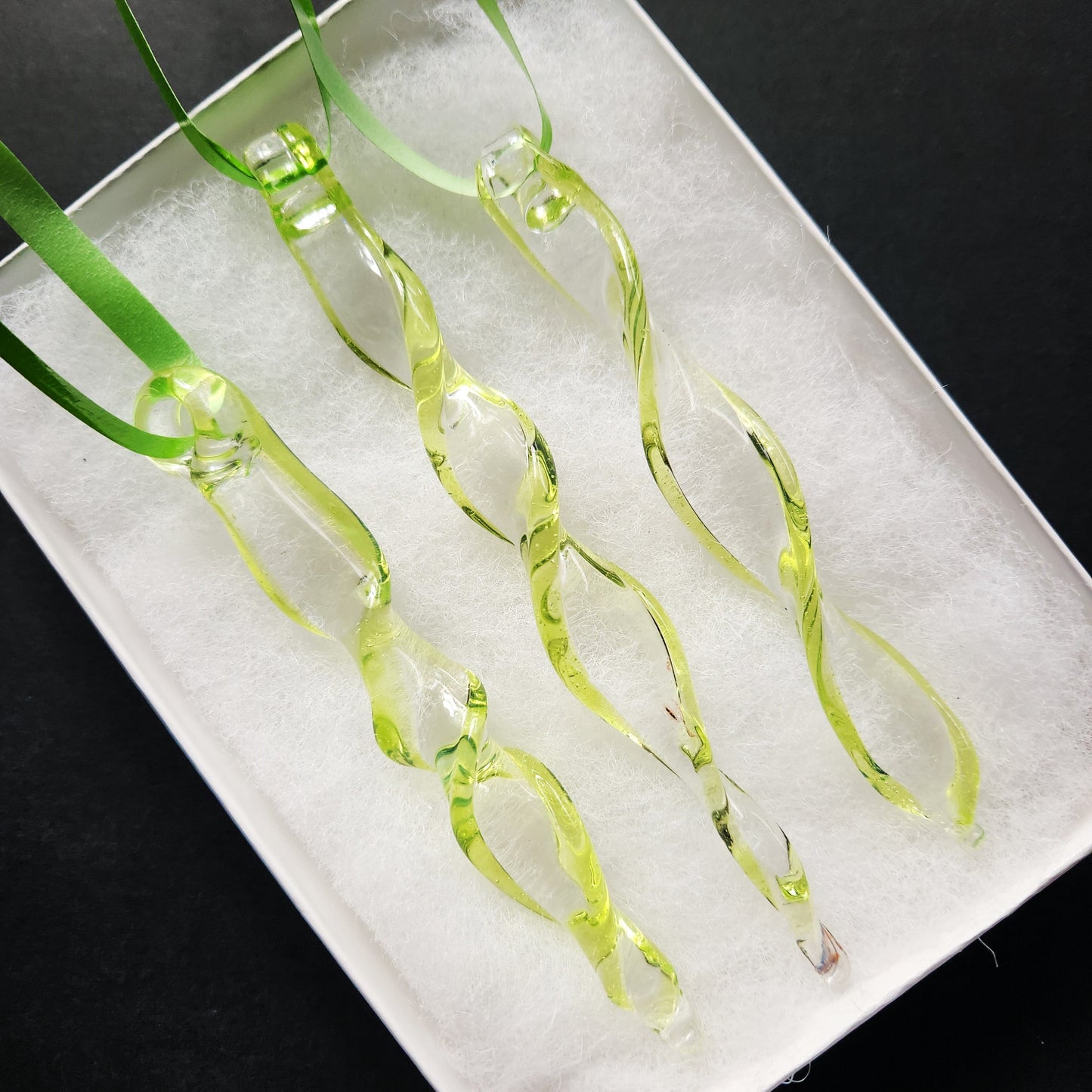 Set of 3 lime green spiral glass suncatchers in a white gift box, ideal for garden decor or gifting handmade glass ornaments.