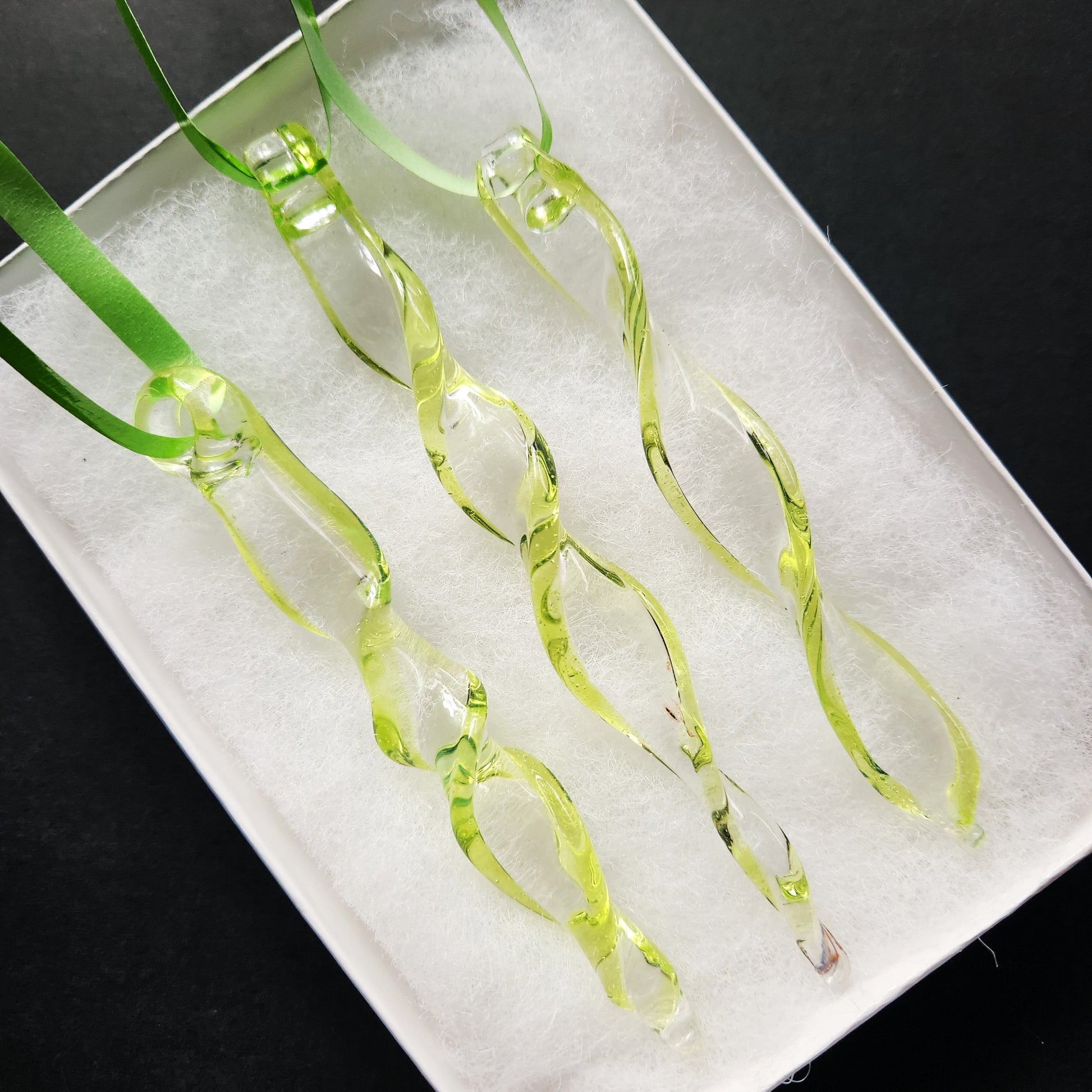 Set of 3 lime green spiral glass suncatchers in a white gift box, ideal for garden decor or gifting handmade glass ornaments.
