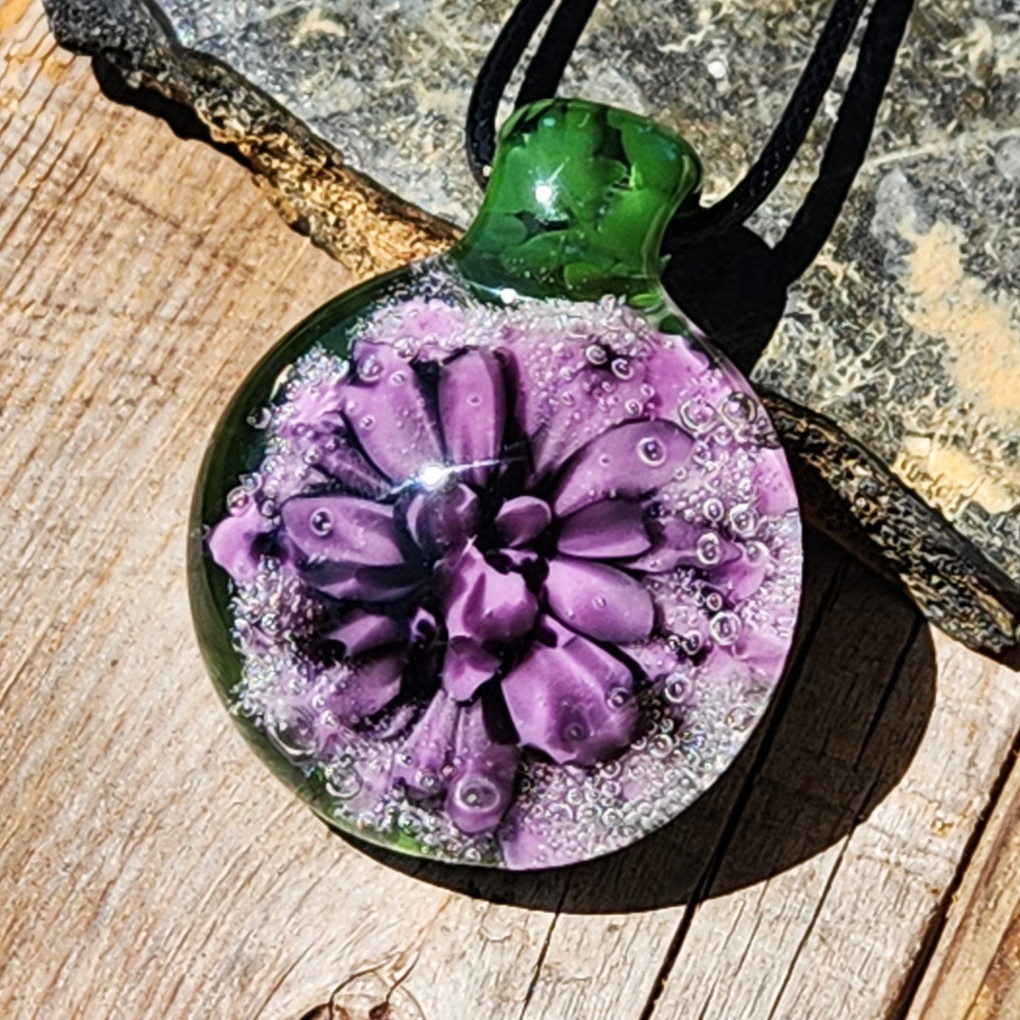 Handmade Borosilicate Glass Pendant: Purple and Black on a Green Background