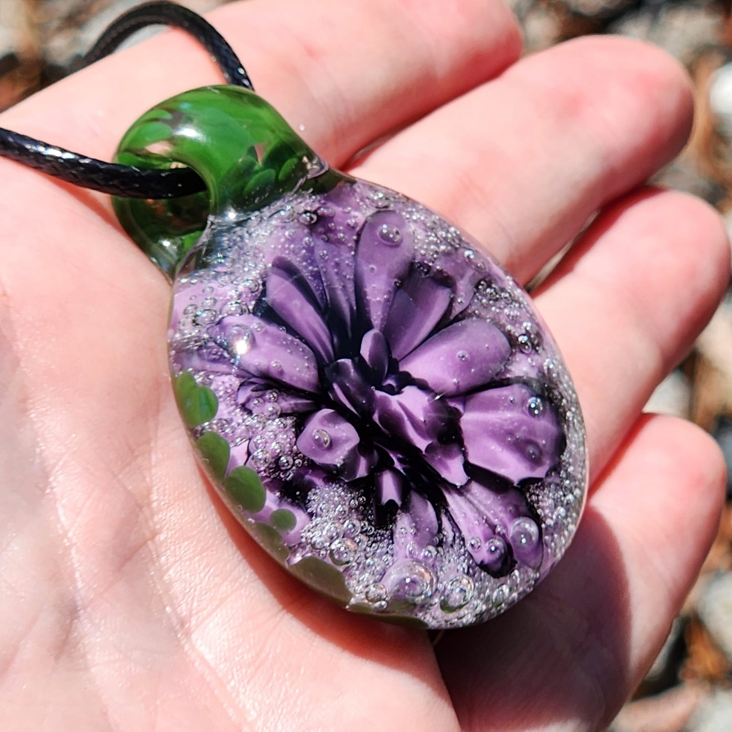 Handmade Borosilicate Glass Pendant: Purple and Black on a Green Background