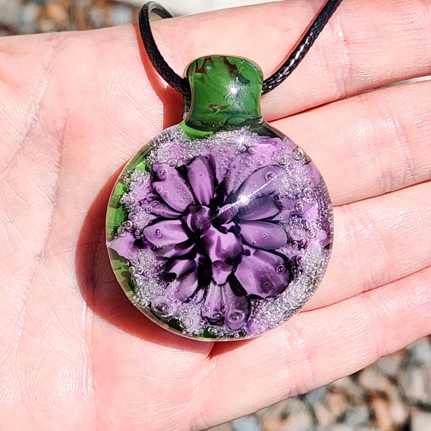 Handmade Borosilicate Glass Pendant: Purple and Black on a Green Background