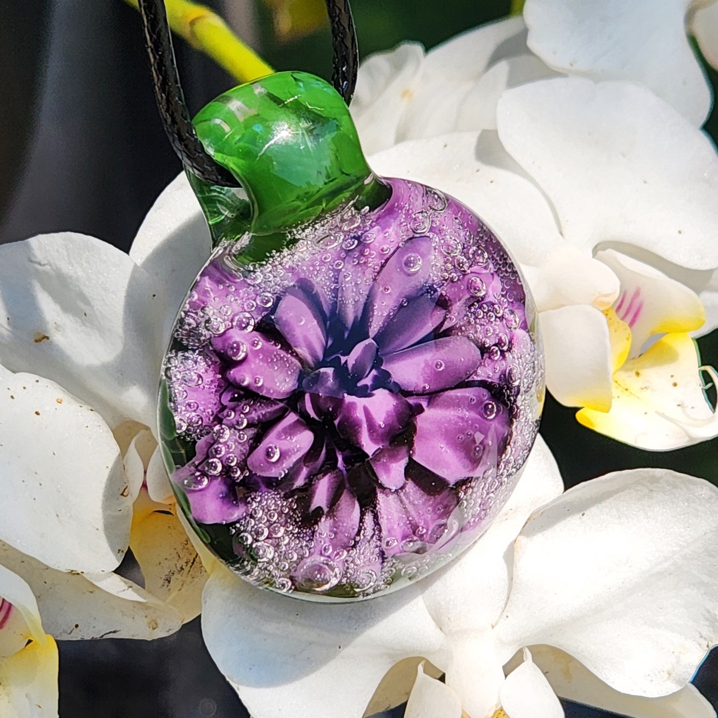 Handmade Borosilicate Glass Pendant: Purple and Black on a Green Background
