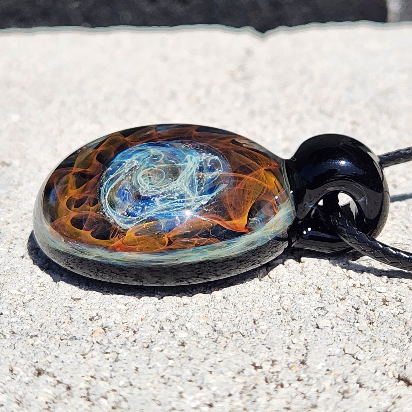 Cosmic Elegance: Handcrafted Glass Pendant with Silver and Gold Accents