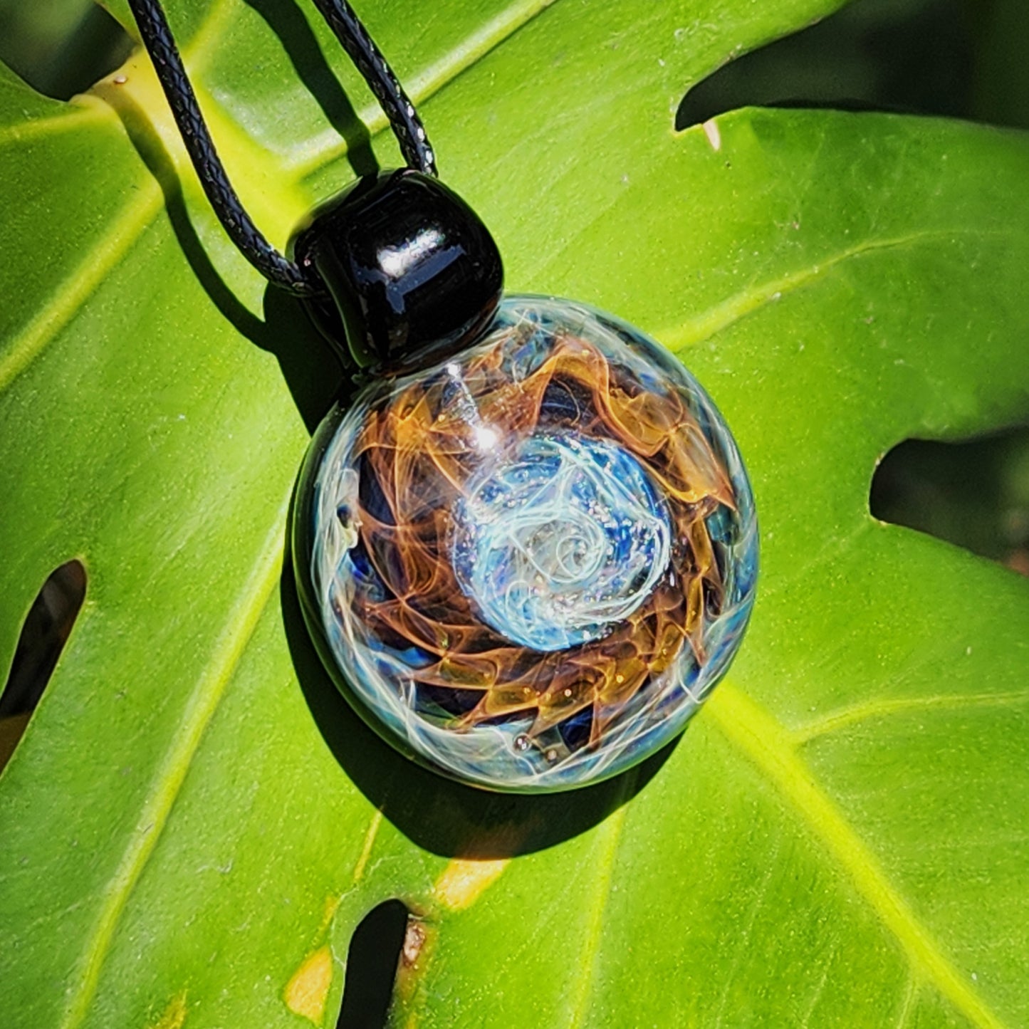 Cosmic Elegance: Handcrafted Glass Pendant with Silver and Gold Accents