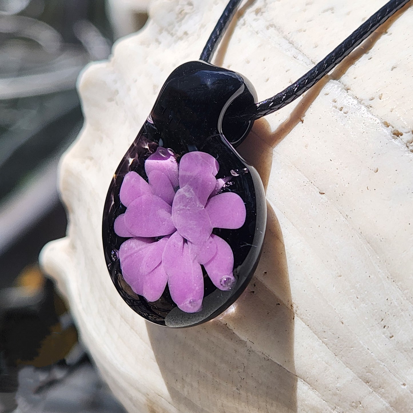 Handmade purple and black glass pendant necklace with floral design, ideal for minimalist jewelry lovers seeking a one-of-a-kind accessory.