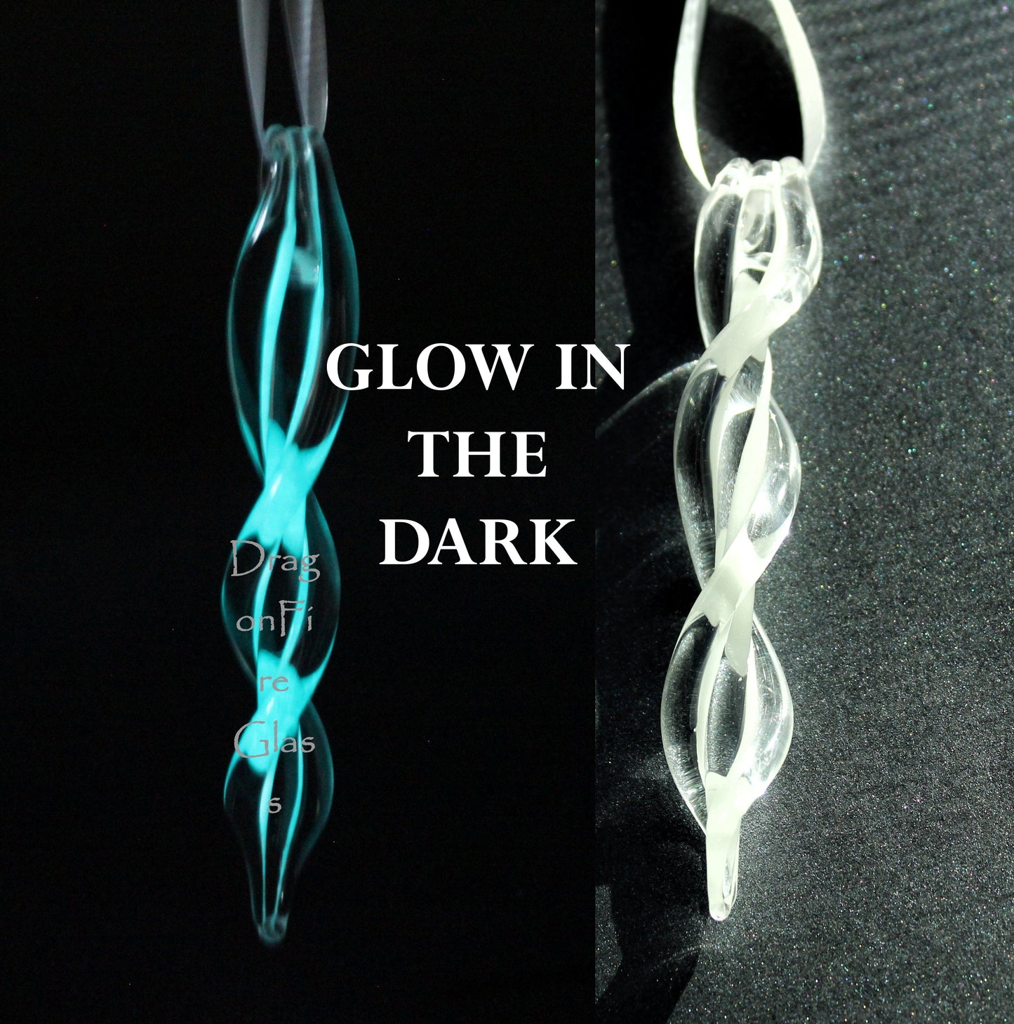 Glow-in-the-dark glass ornament with twisted spiral design shown glowing at night and clear in daylight. Handmade Christmas keepsake for holiday decor.