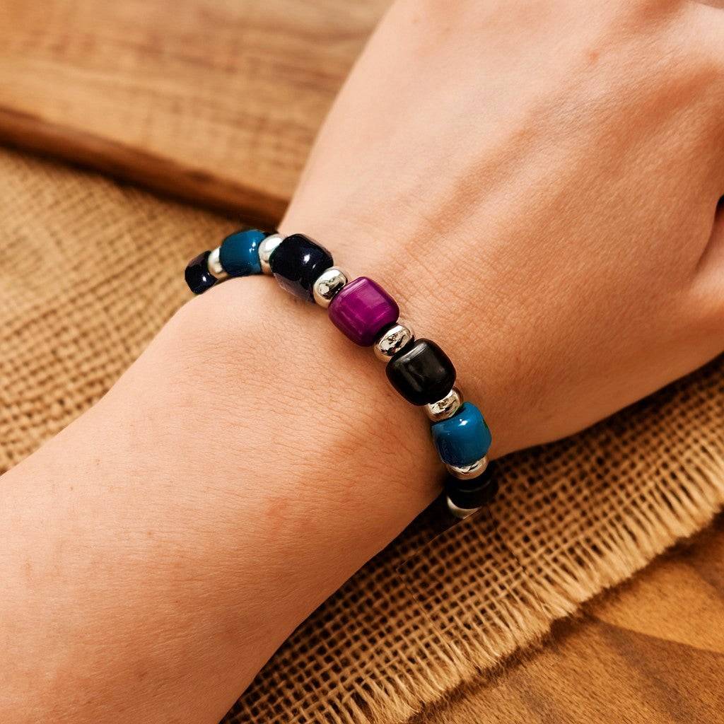Boho Glass Beaded Bracelet worn on wrist, showing adjustable fit and colorful handmade glass beads in a casual setting.