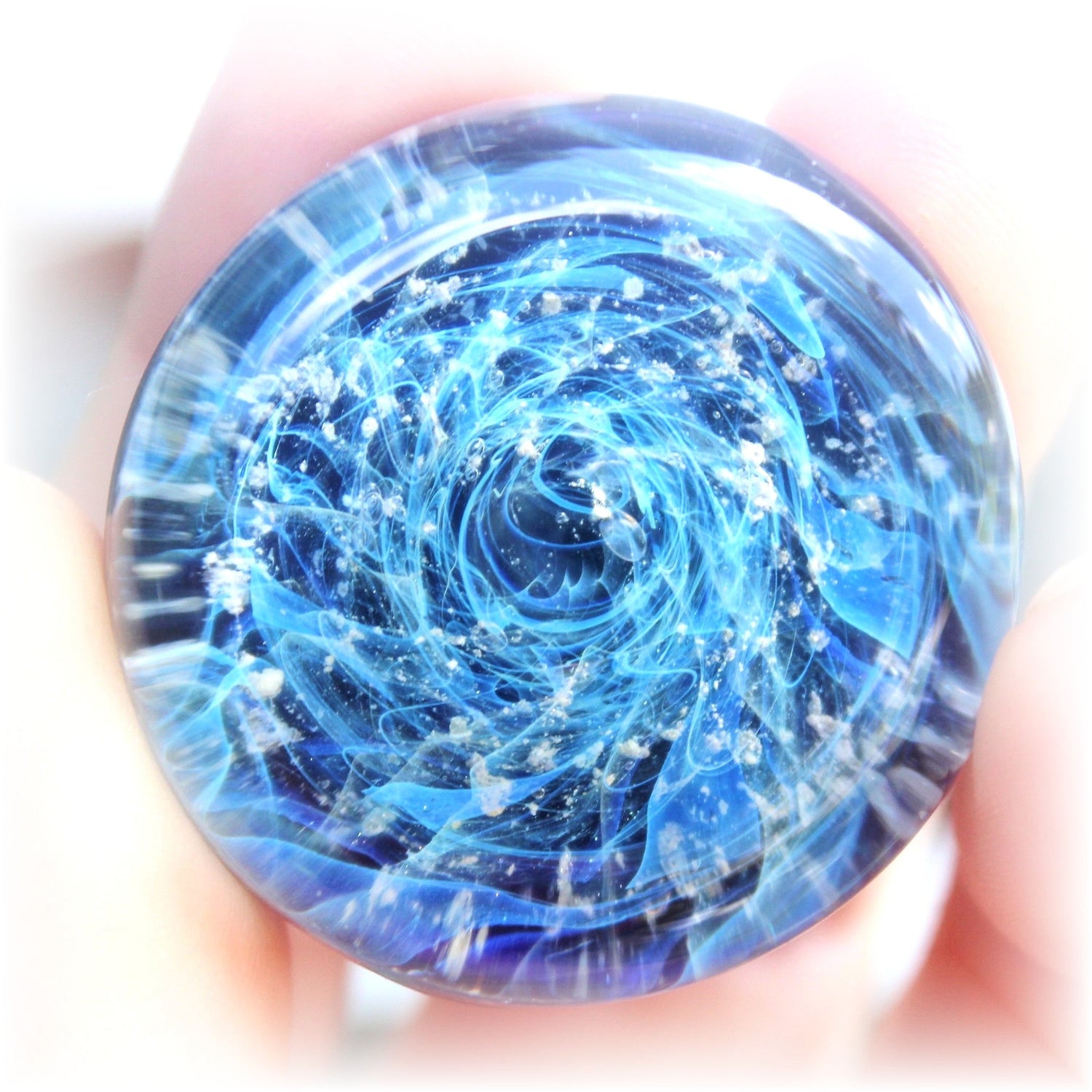 Mesmerizing blue vortex cremation pendant with swirling galaxy design.