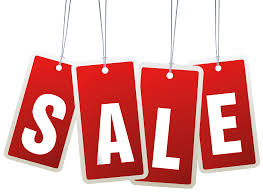 Bold red sale tags hanging with white letters spellingSALE