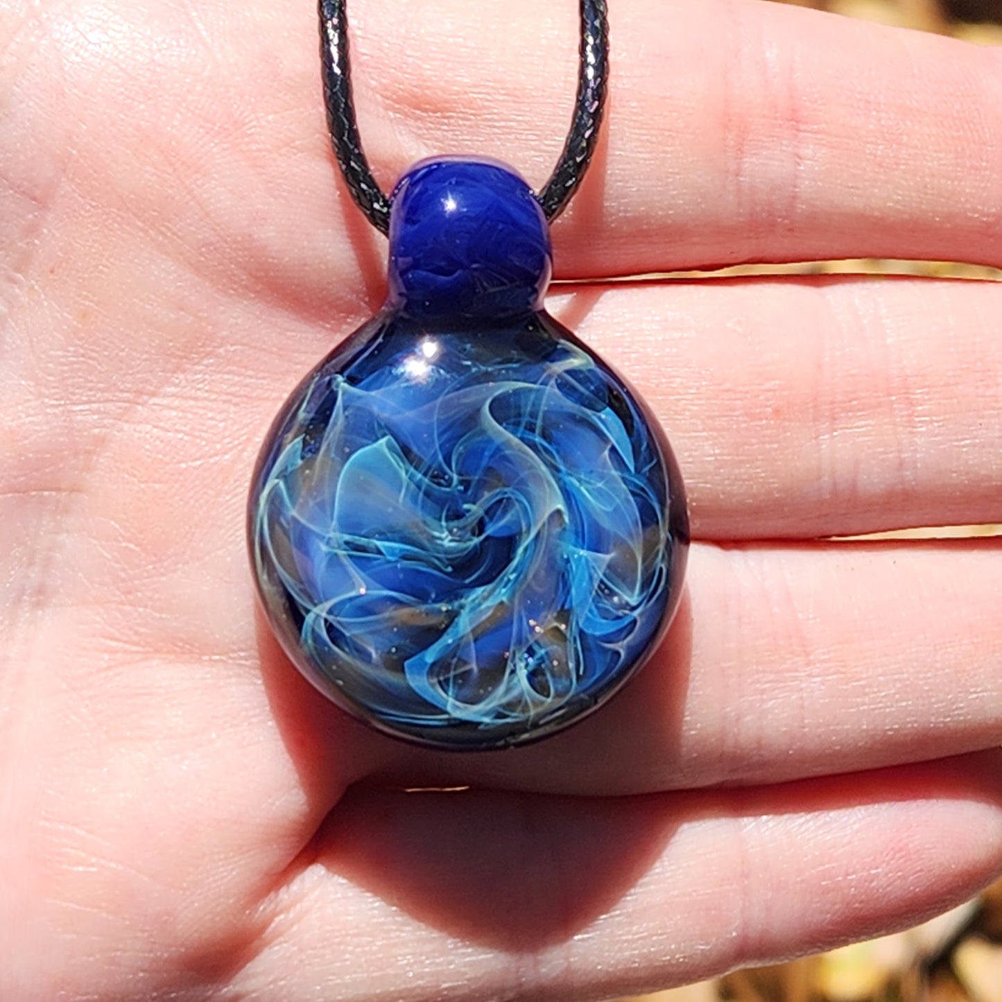 Cosmic Elegance: Handcrafted Glass Pendant with Silver, Gold, and Purple Accents