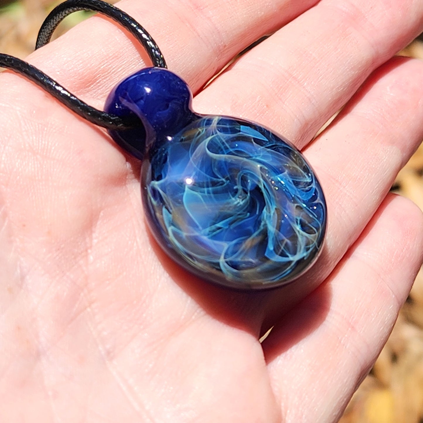 Cosmic Elegance: Handcrafted Glass Pendant with Silver, Gold, and Purple Accents