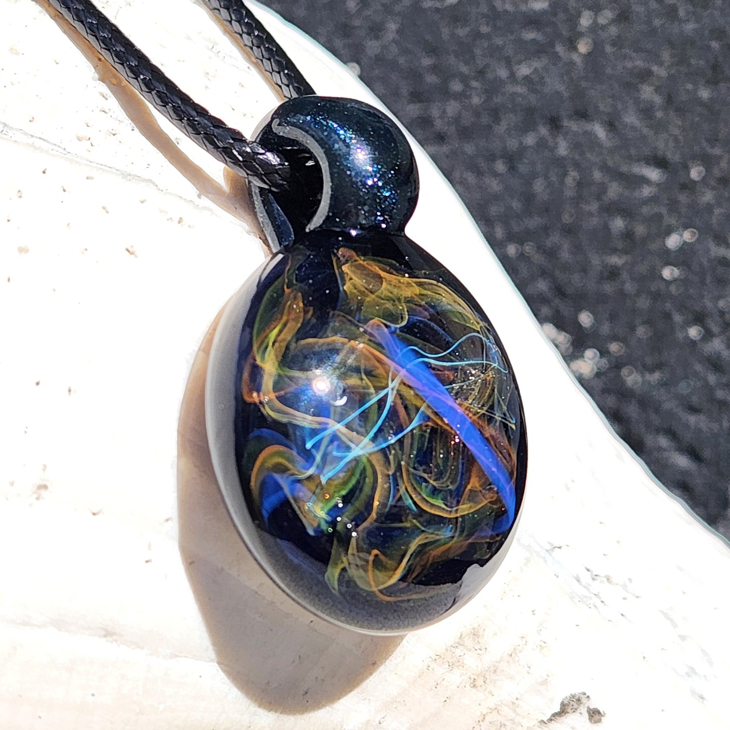 Cosmic Elegance: Handcrafted Glass Pendant with Silver, Gold, and Purple Accents