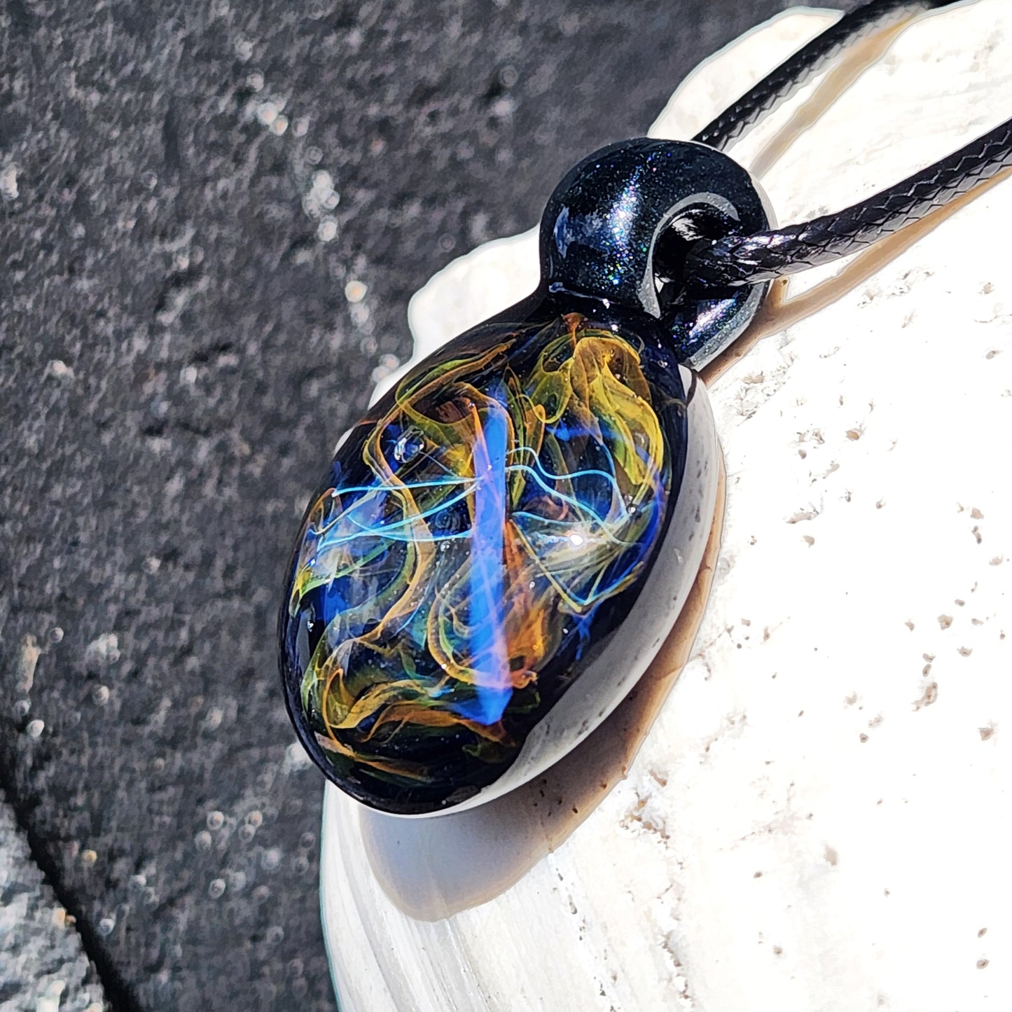 Cosmic Elegance: Handcrafted Glass Pendant with Silver, Gold, and Purple Accents