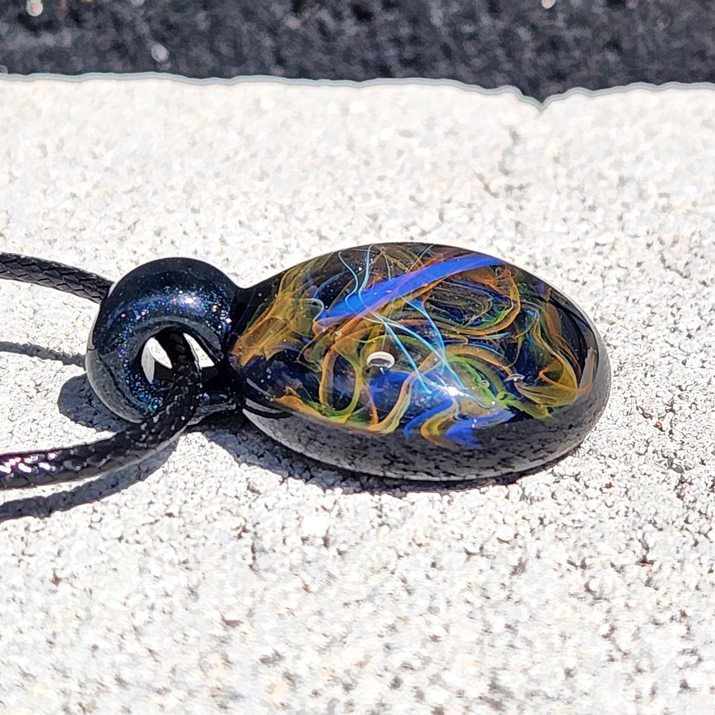 Cosmic Elegance: Handcrafted Glass Pendant with Silver, Gold, and Purple Accents