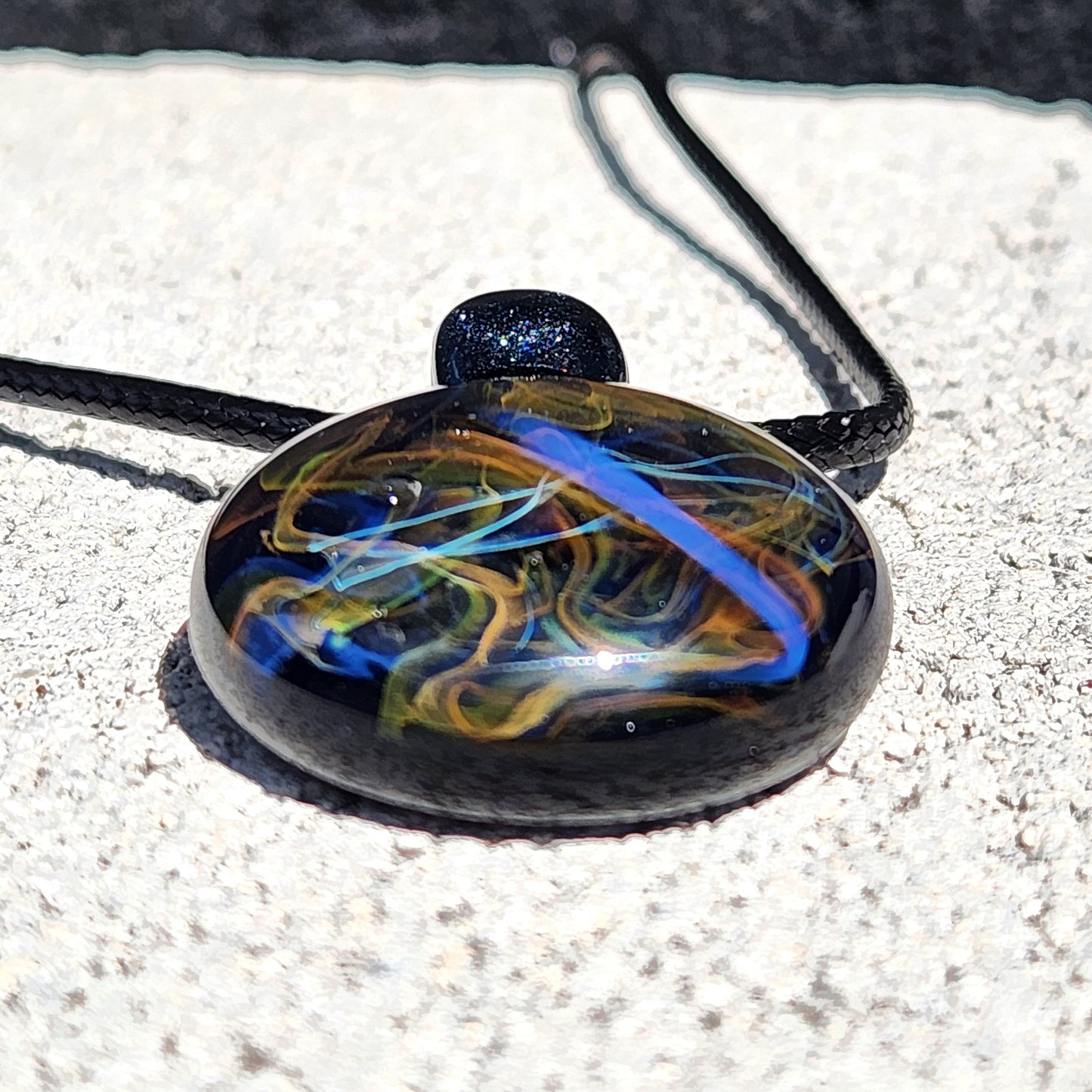 Cosmic Elegance: Handcrafted Glass Pendant with Silver, Gold, and Purple Accents