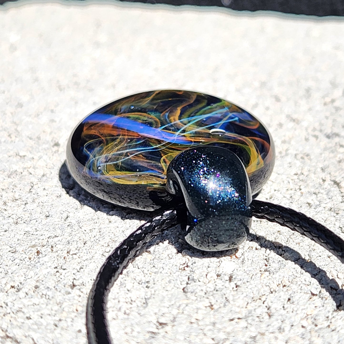 Cosmic Elegance: Handcrafted Glass Pendant with Silver, Gold, and Purple Accents