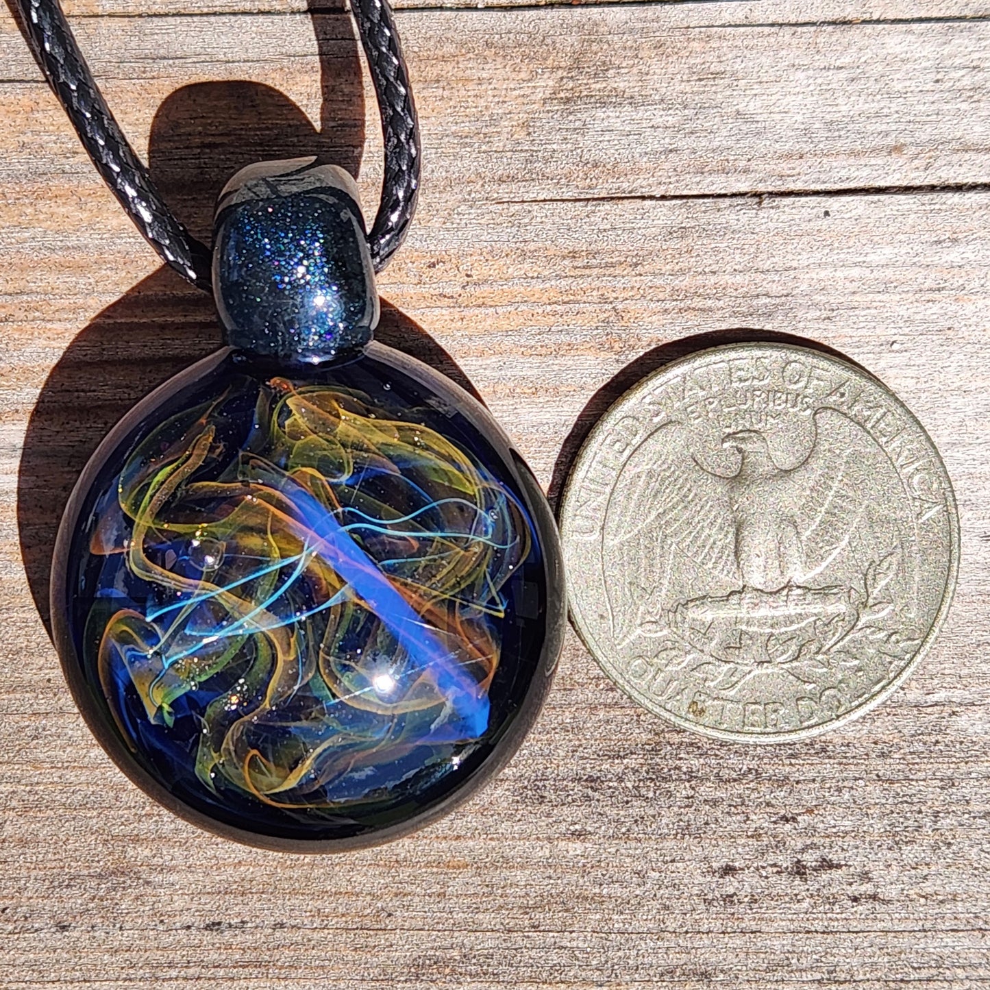 Cosmic Elegance: Handcrafted Glass Pendant with Silver, Gold, and Purple Accents