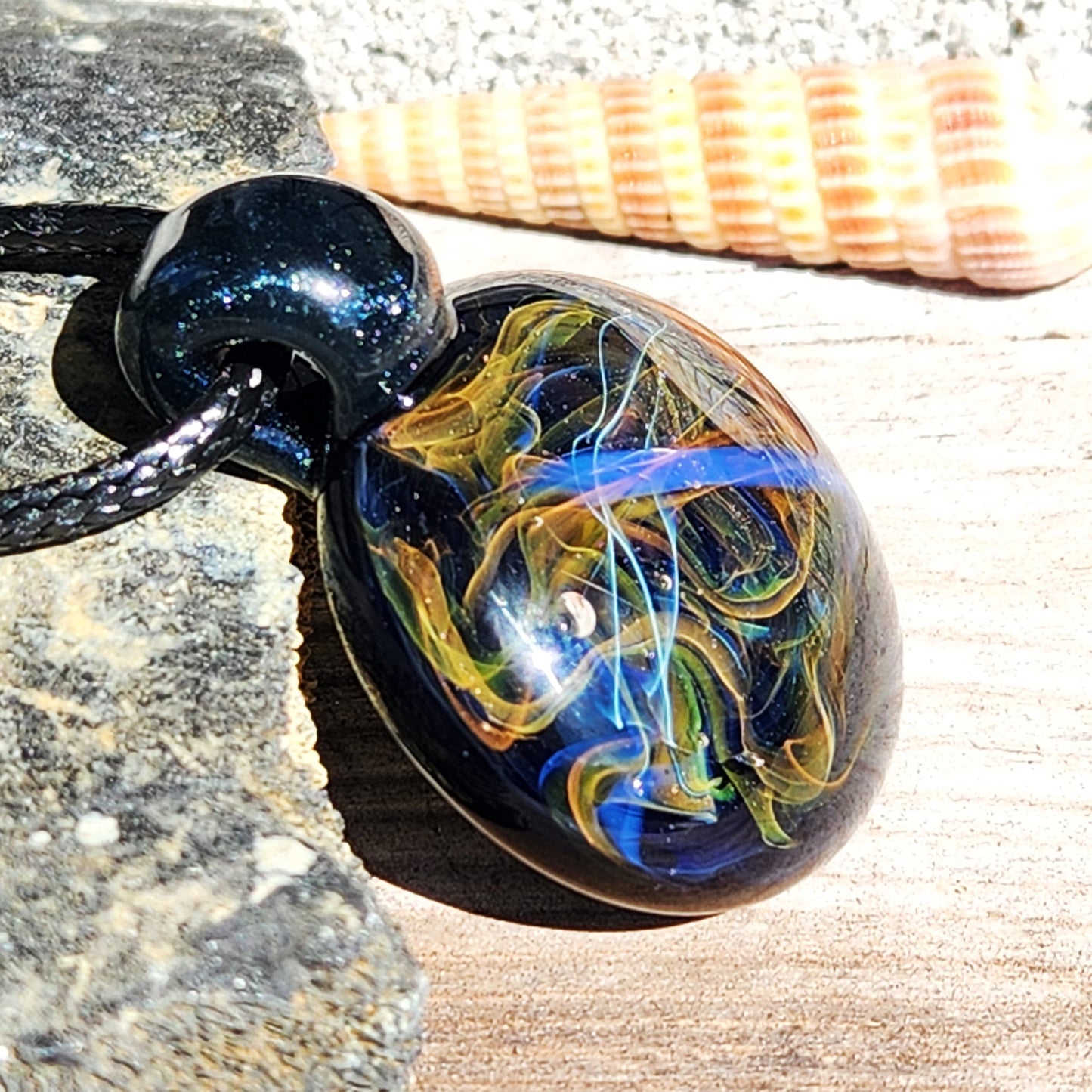 Cosmic Elegance: Handcrafted Glass Pendant with Silver, Gold, and Purple Accents