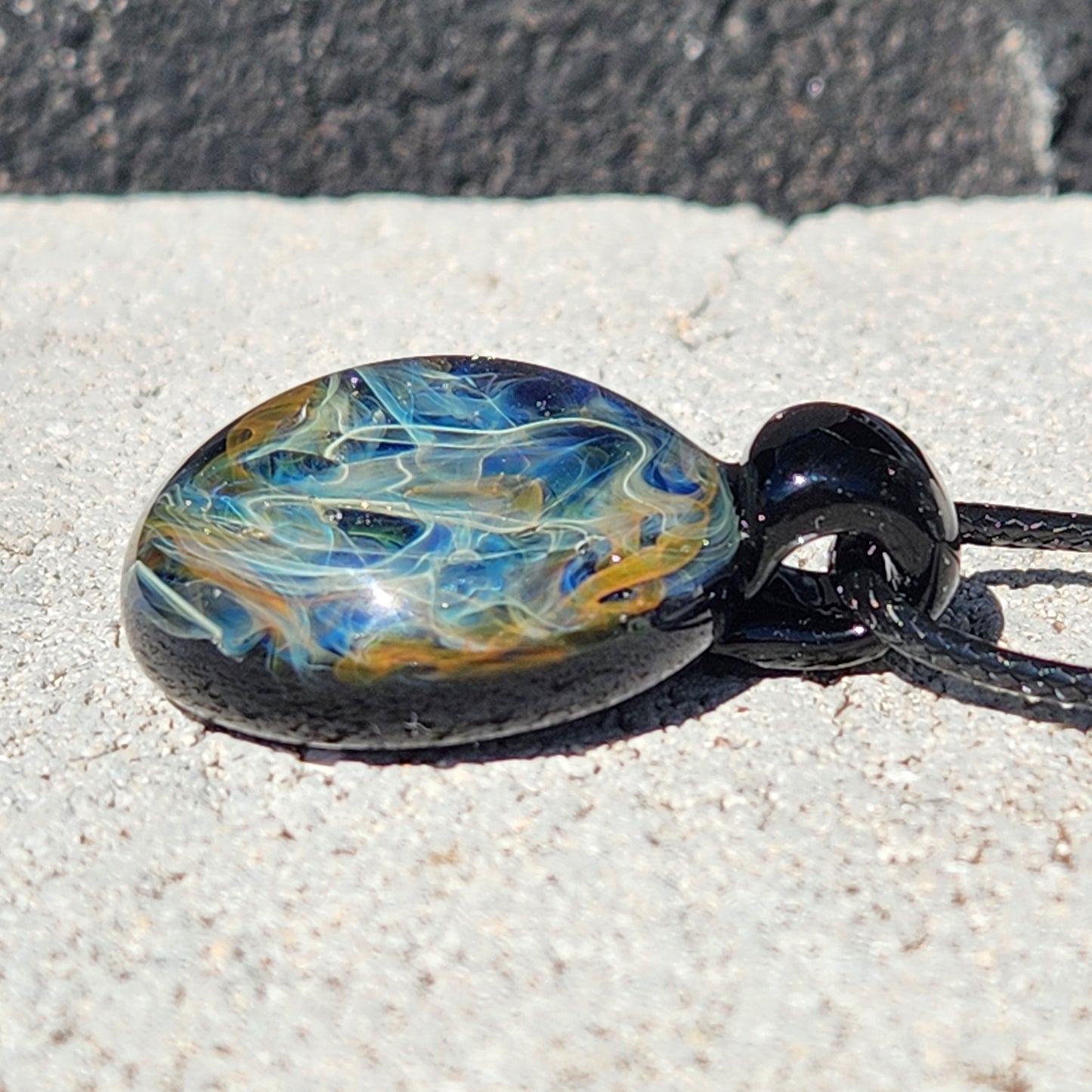 Cosmic Elegance: Handcrafted Glass Pendant with Silver and Gold Accents