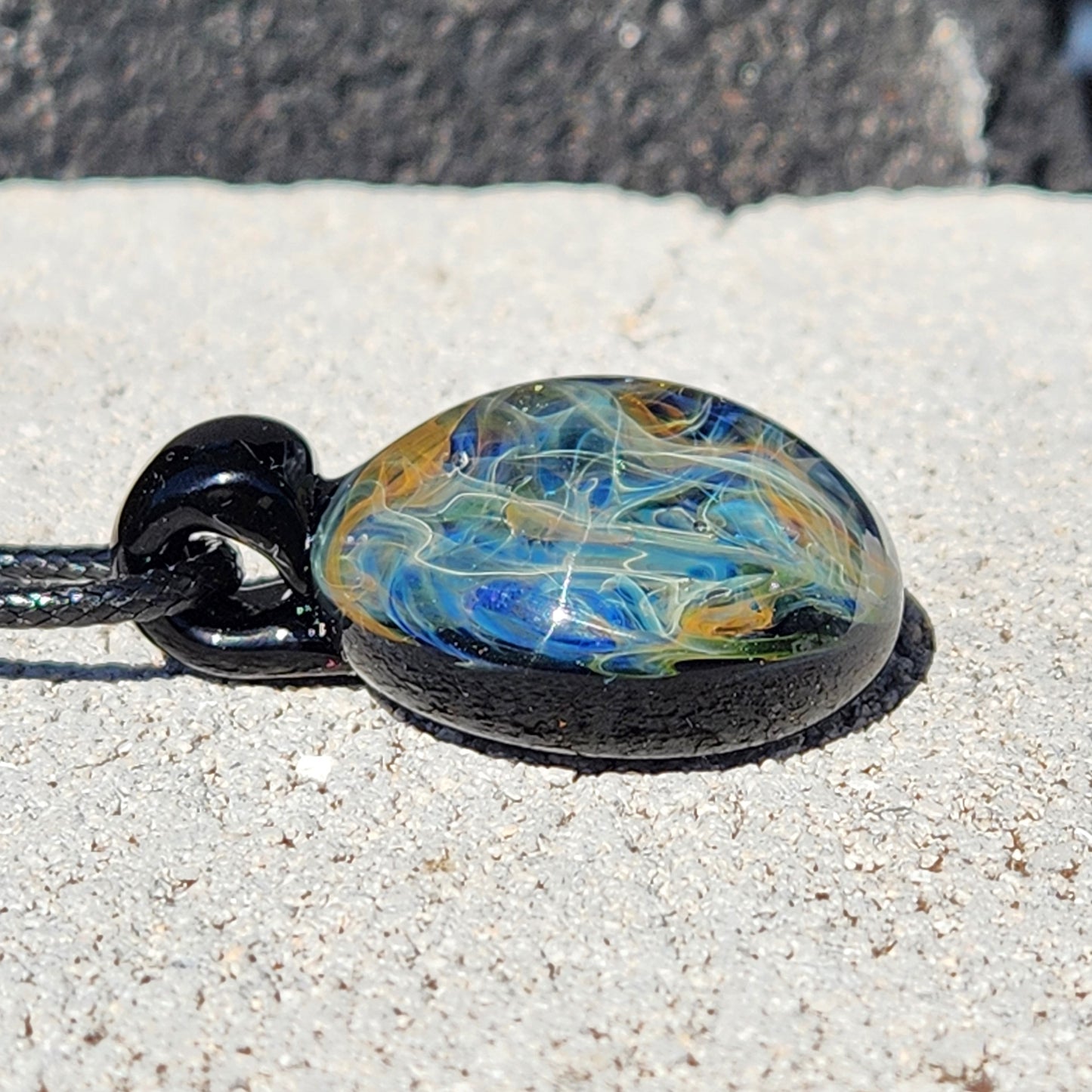 Cosmic Elegance: Handcrafted Glass Pendant with Silver and Gold Accents