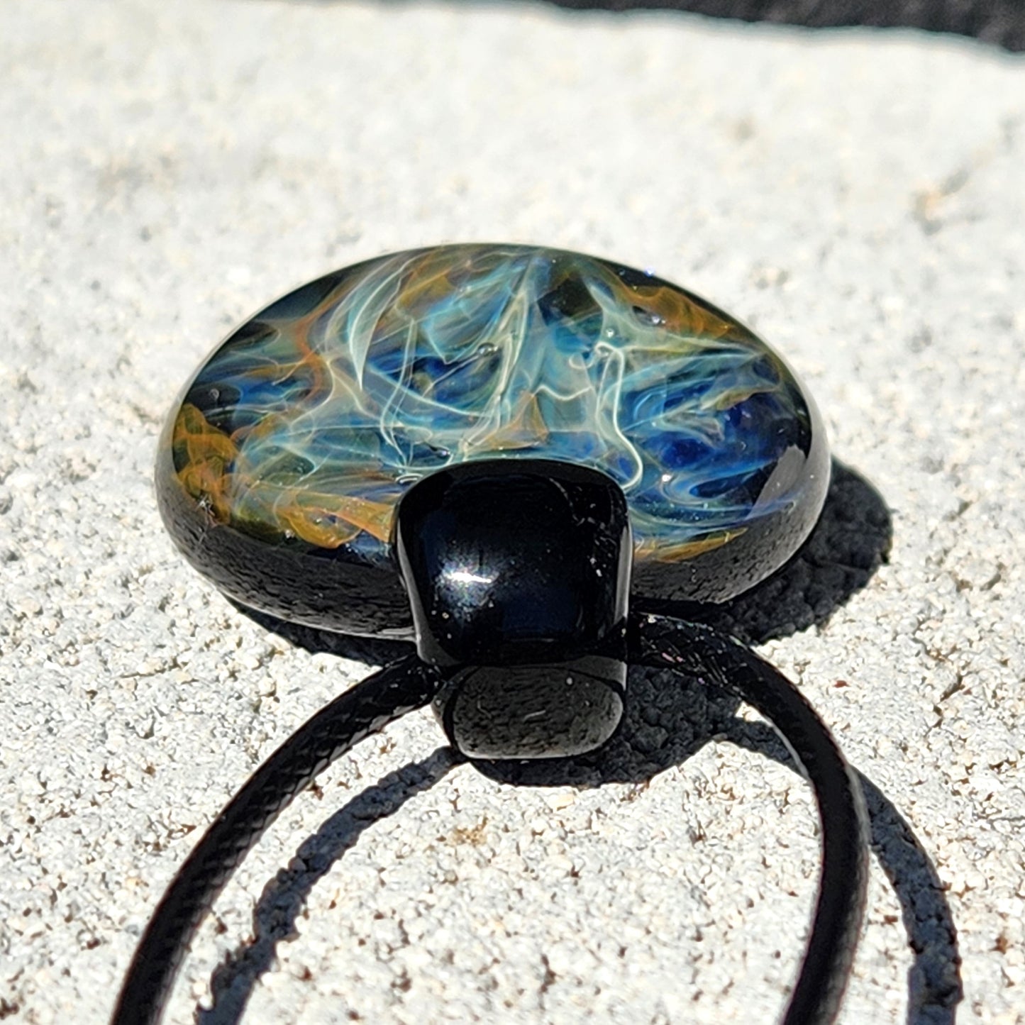 Cosmic Elegance: Handcrafted Glass Pendant with Silver and Gold Accents