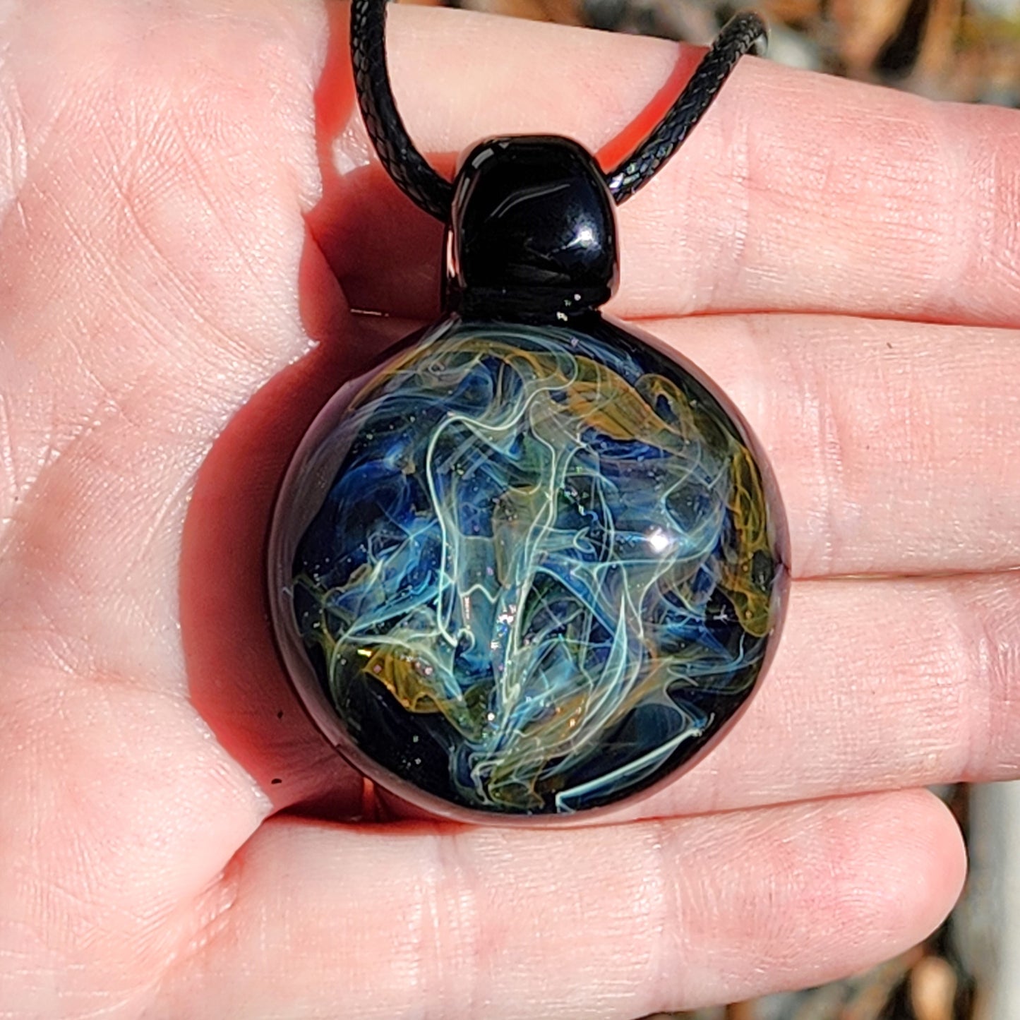 Cosmic Elegance: Handcrafted Glass Pendant with Silver and Gold Accents