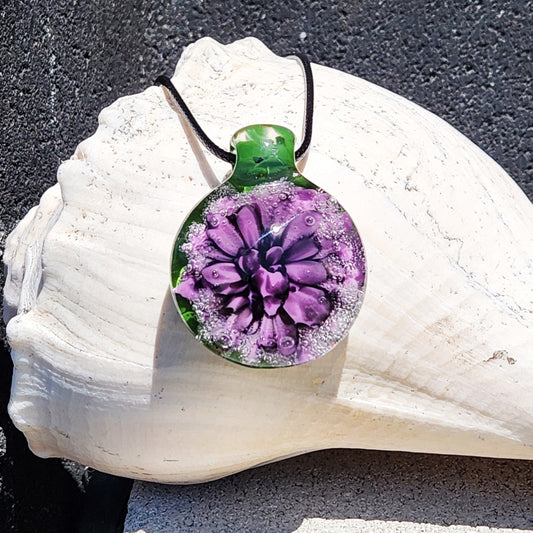 Handmade Borosilicate Glass Pendant: Purple and Black on a Green Background