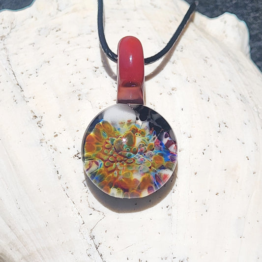 Ocean Reef Inspired Glass Pendant with red loop and multicolor reef pattern, handmade blown glass jewelry for unique ocean-themed style.