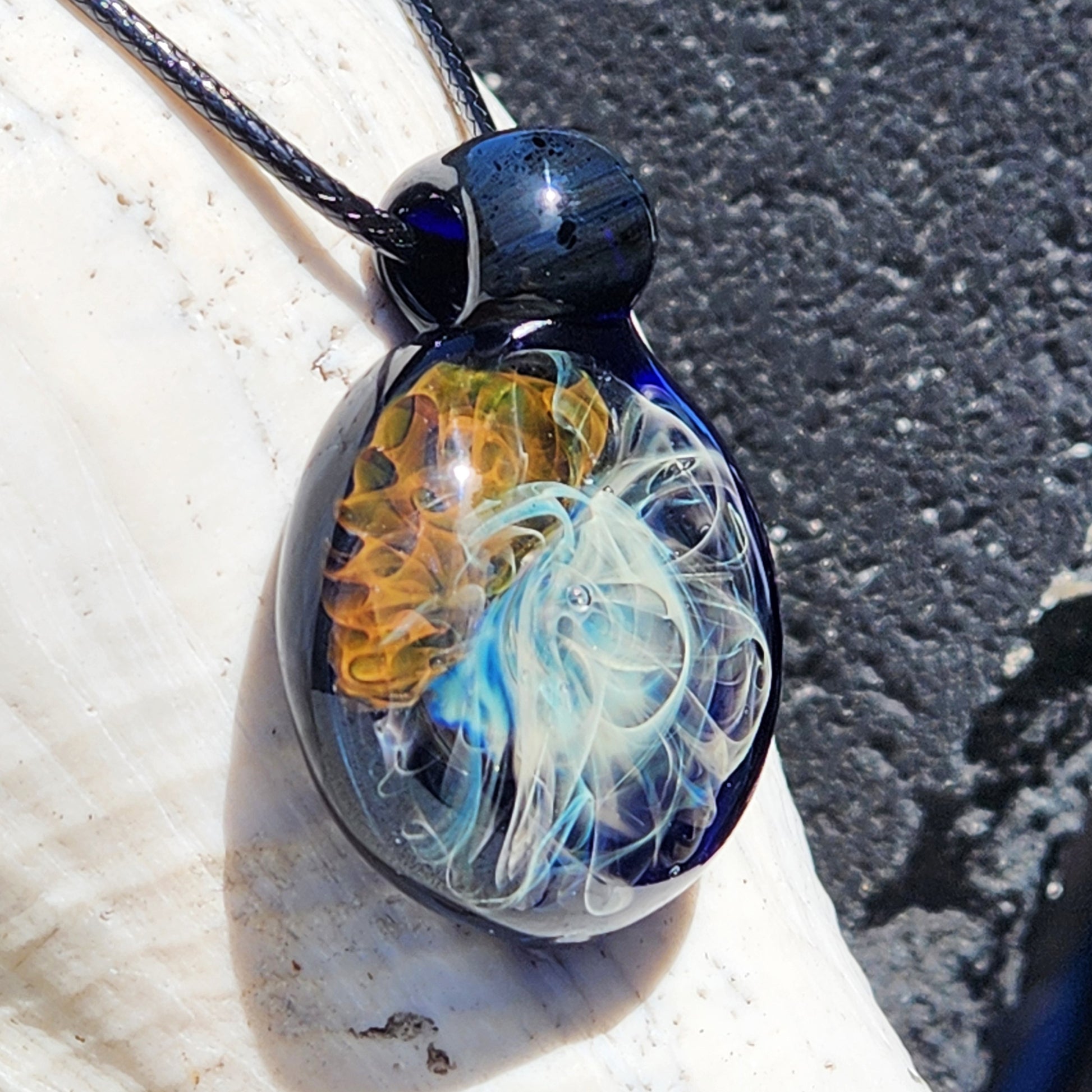 Handmade Gold & Silver Fumed Glass Pendant Necklace showcasing intricate implosion art in blue, gold, and silver tones. Unique jewelry gift.