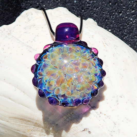 Handmade glass pendant necklace with rainbow metallic shimmer, featuring a large multicolor design and purple accents. Unique borosilicate jewelry gift.