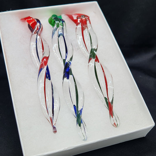 Set of 3 handmade glass ornaments in red, green, and blue swirl design, gift-boxed for holiday giving. Ideal for Christmas tree decor.