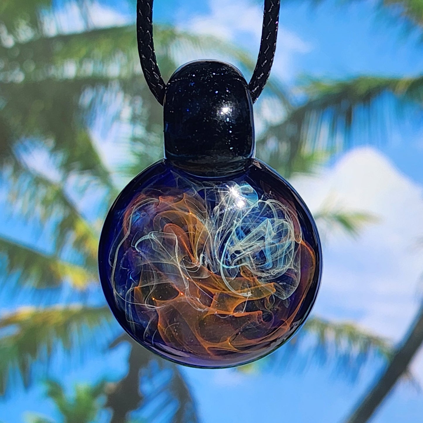 Gold & Silver Fumed Glass Pendant on Deep Blue Background