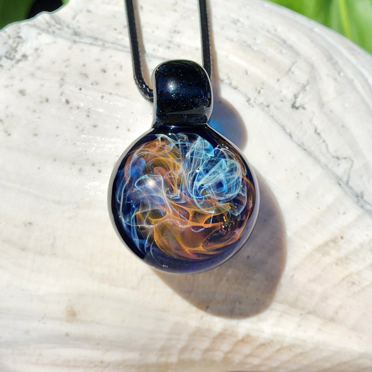 Gold & Silver Fumed Glass Pendant on Deep Blue Background
