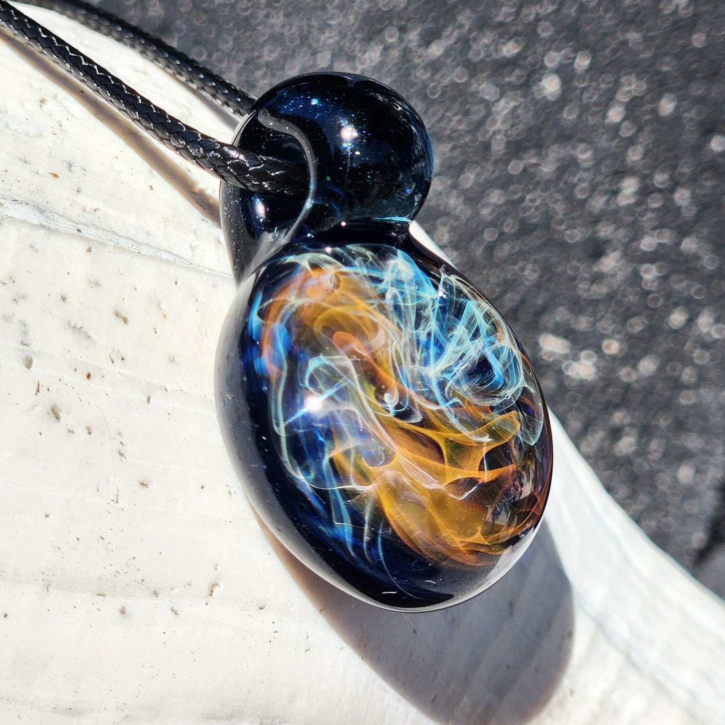 Gold & Silver Fumed Glass Pendant on Deep Blue Background