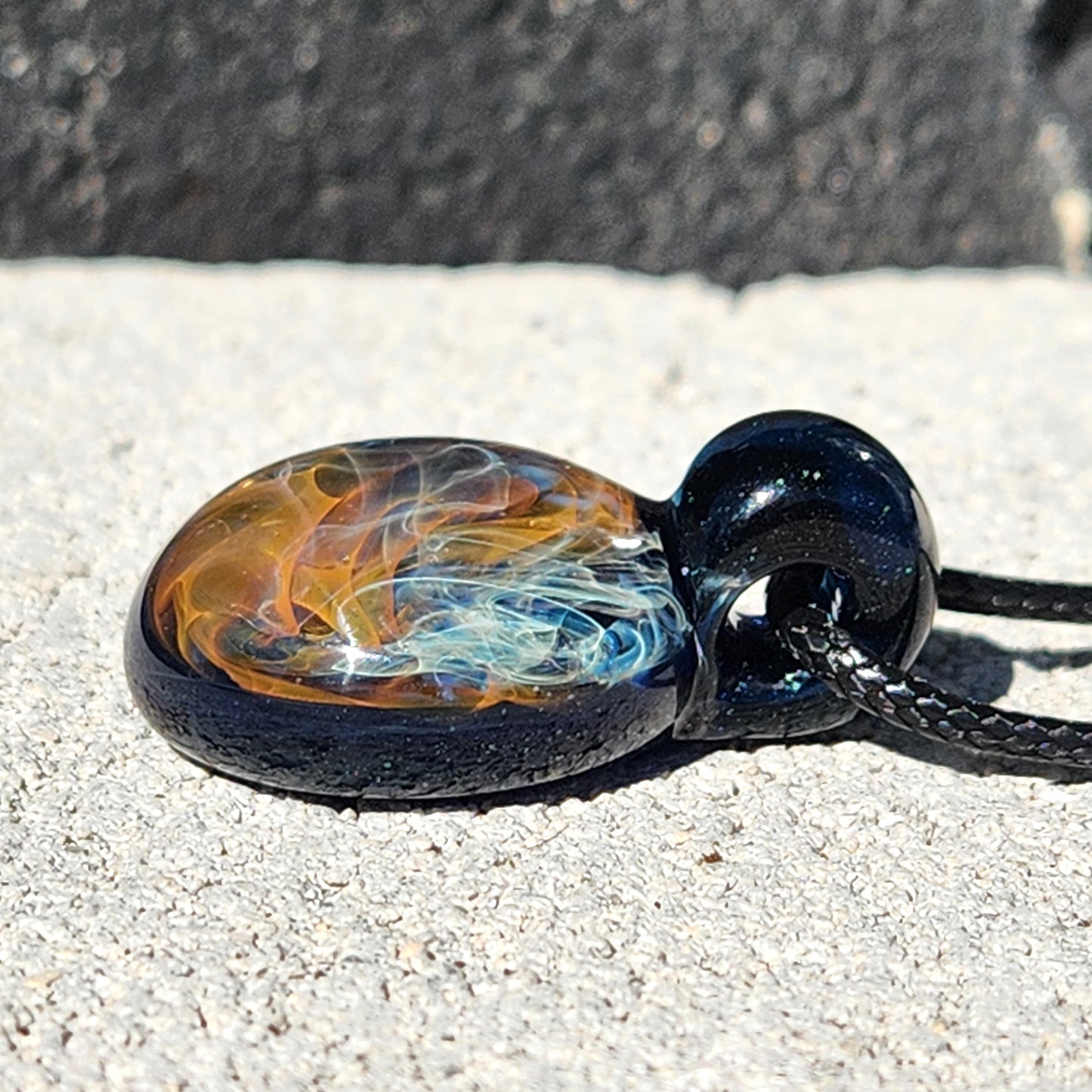 Gold & Silver Fumed Glass Pendant on Deep Blue Background