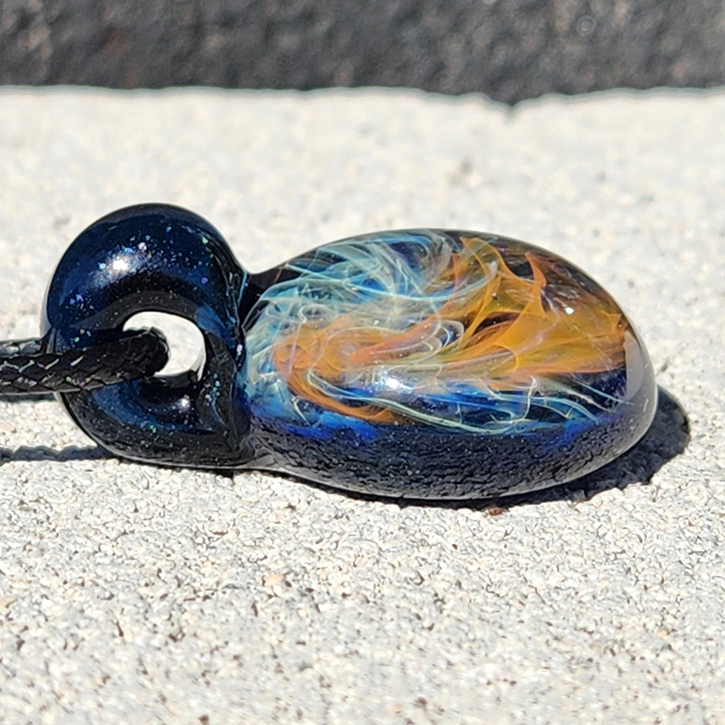Gold & Silver Fumed Glass Pendant on Deep Blue Background