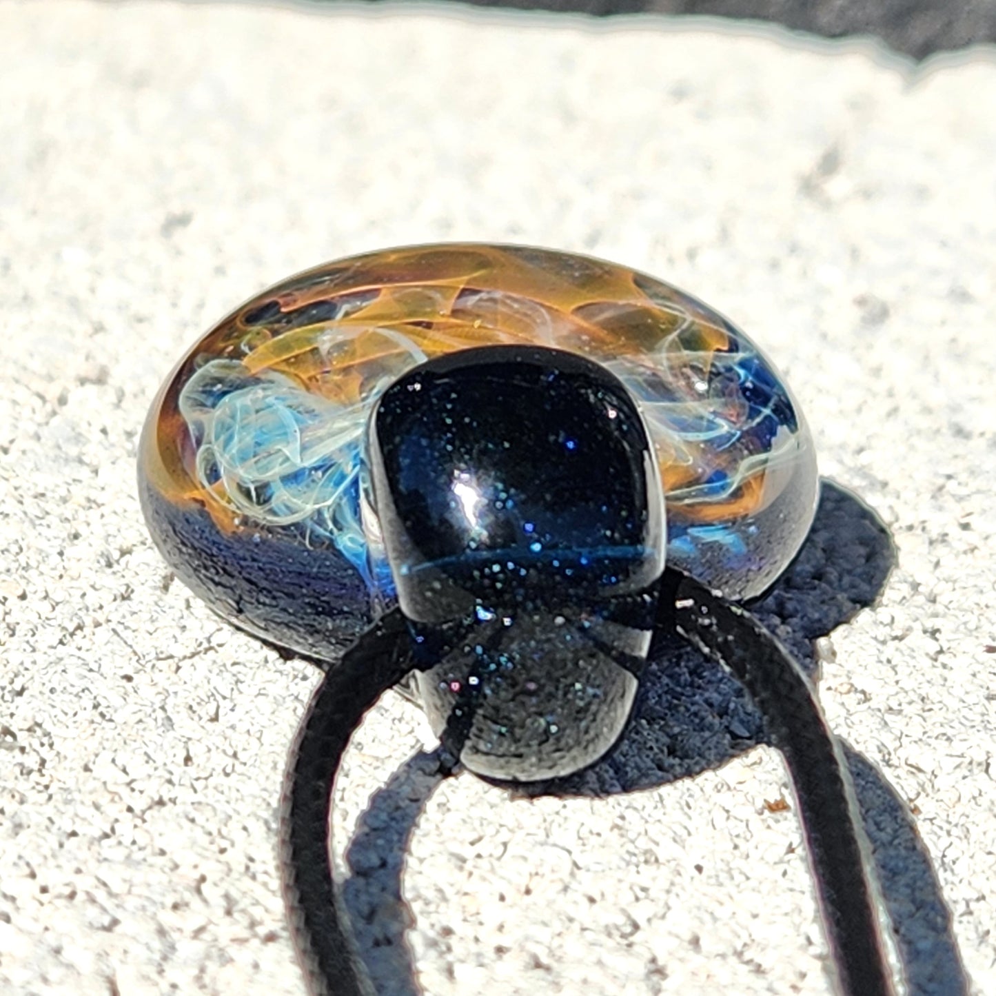 Gold & Silver Fumed Glass Pendant on Deep Blue Background