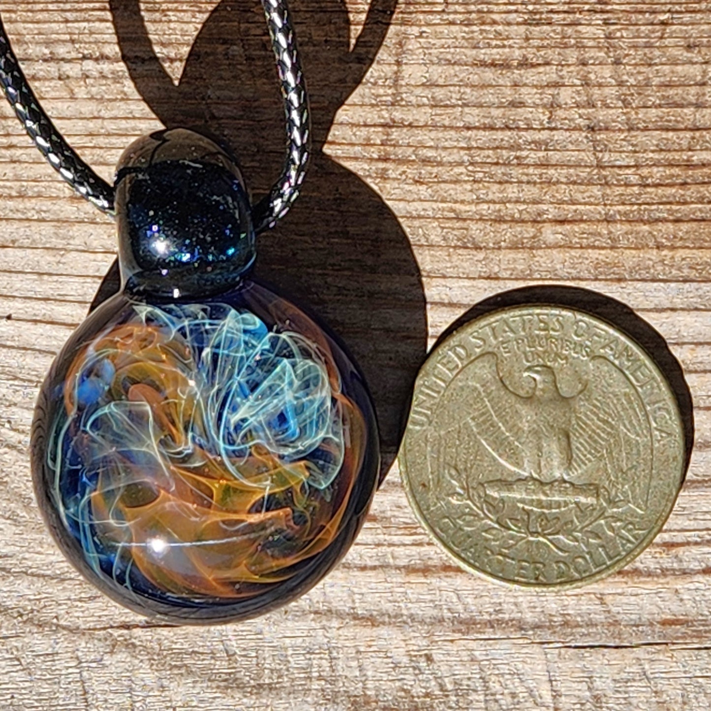 Gold & Silver Fumed Glass Pendant on Deep Blue Background