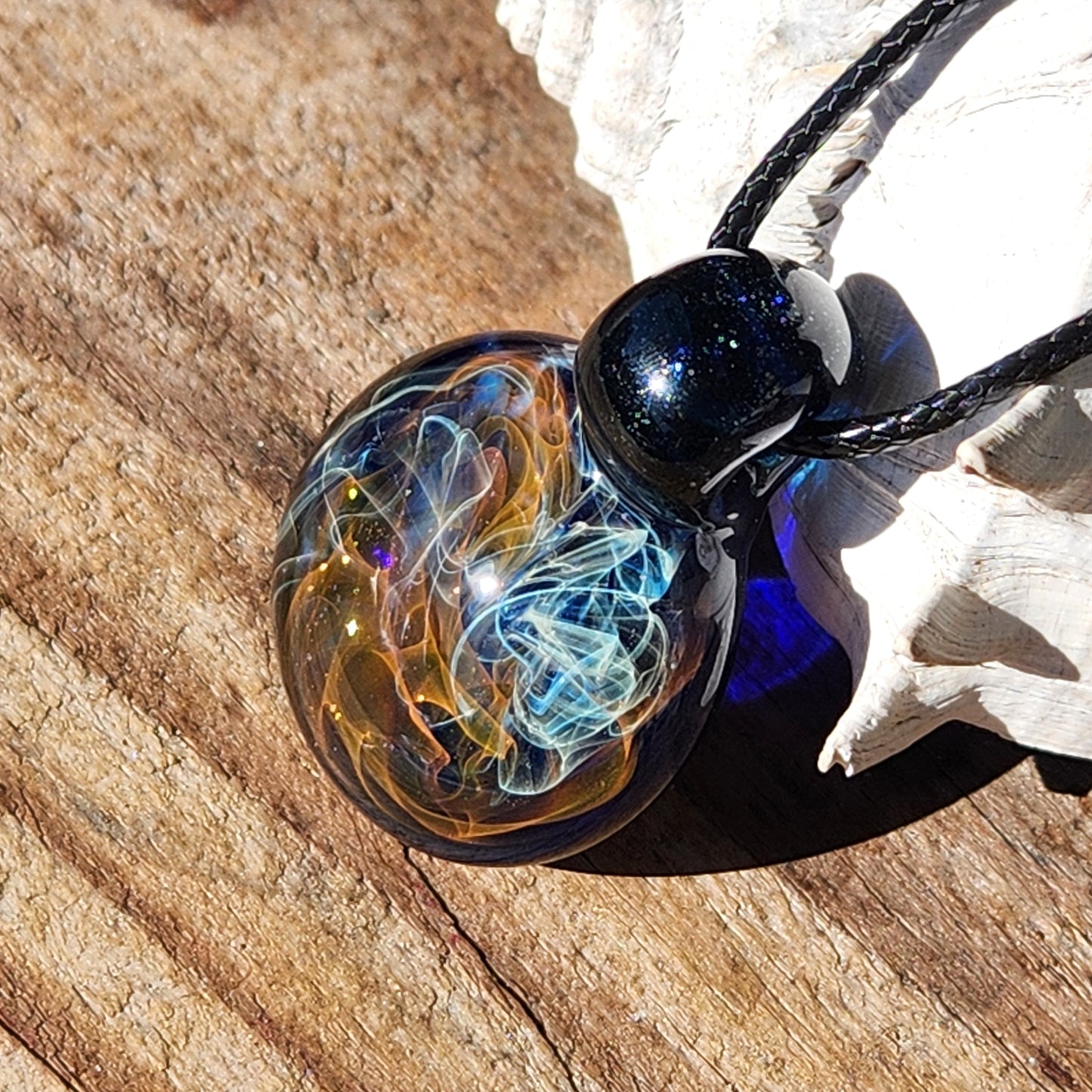 Gold & Silver Fumed Glass Pendant on Deep Blue Background
