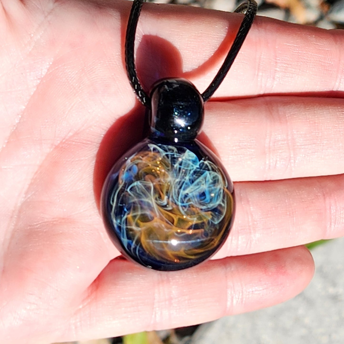 Gold & Silver Fumed Glass Pendant on Deep Blue Background