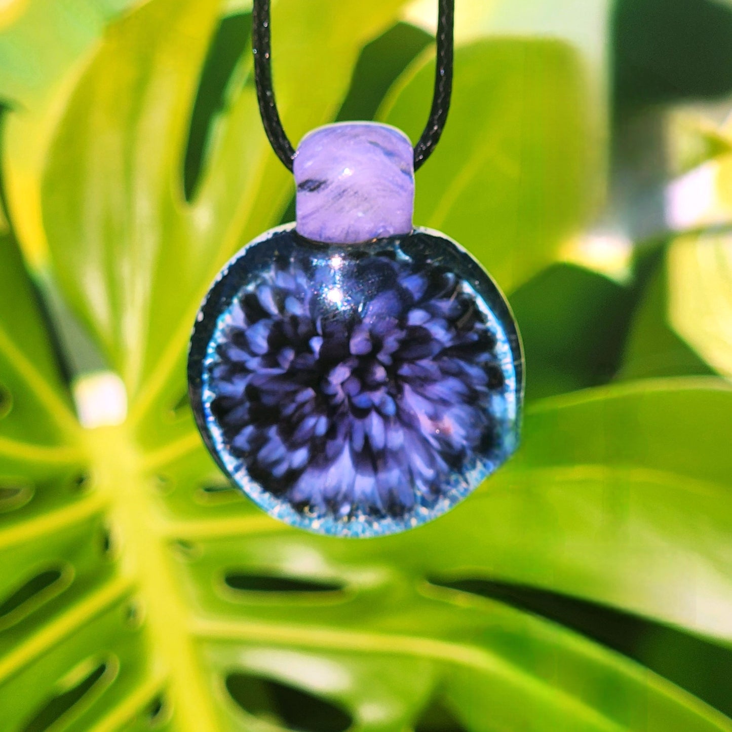 Purple Pink Borosilicate Glass Pendant Necklace on foliage