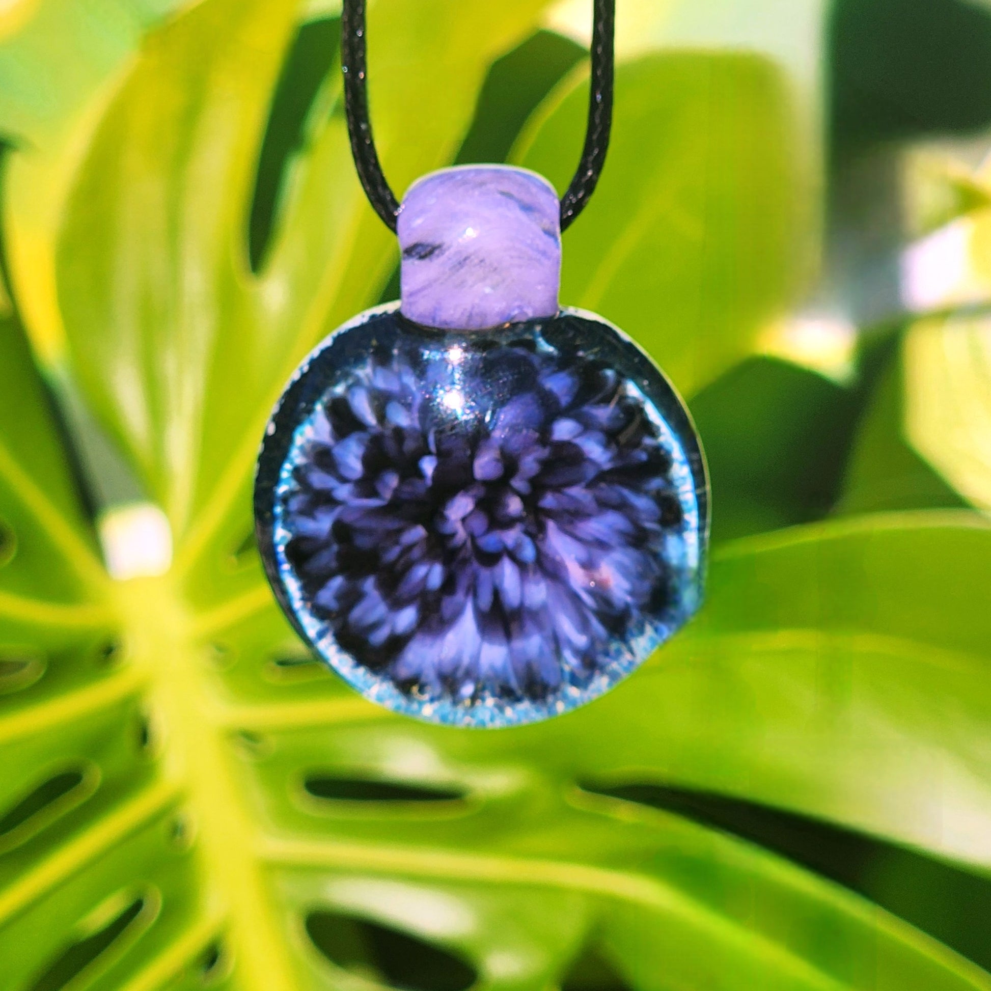 Purple Pink Borosilicate Glass Pendant Necklace on foliage