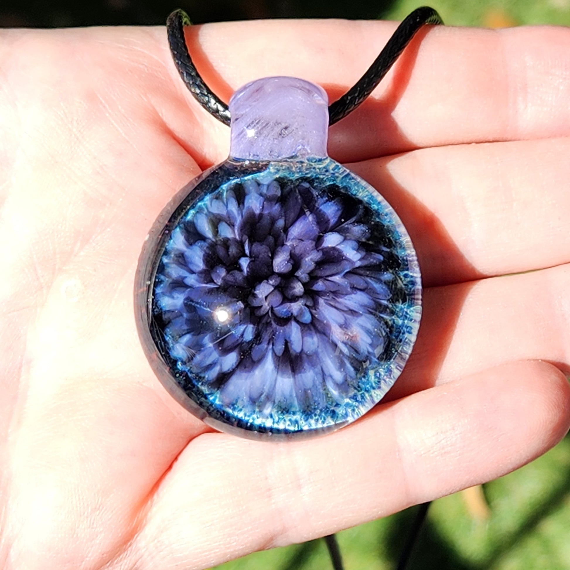 Purple Pink Borosilicate Glass Pendant Necklace held in hand