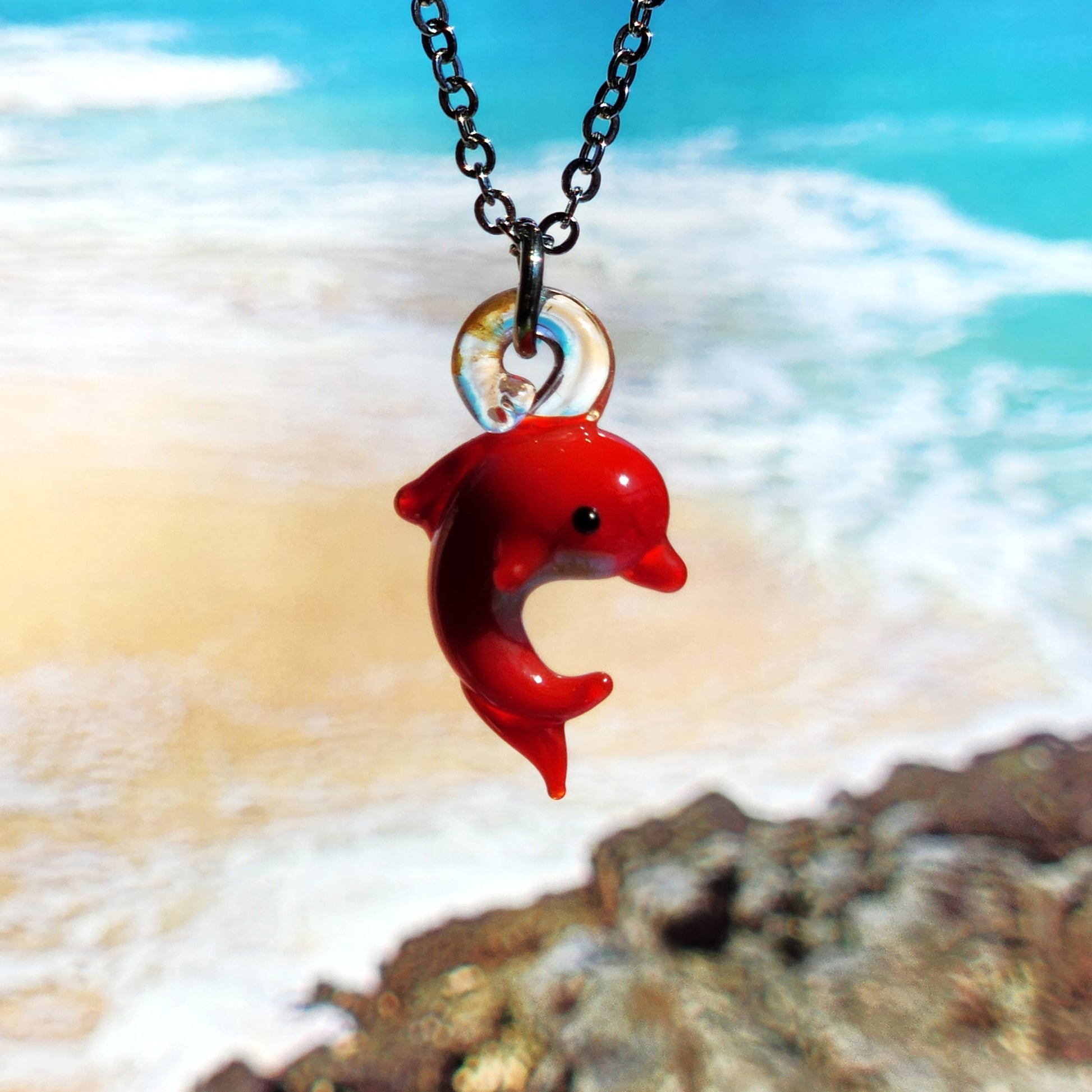 Red dolphin pendant necklace