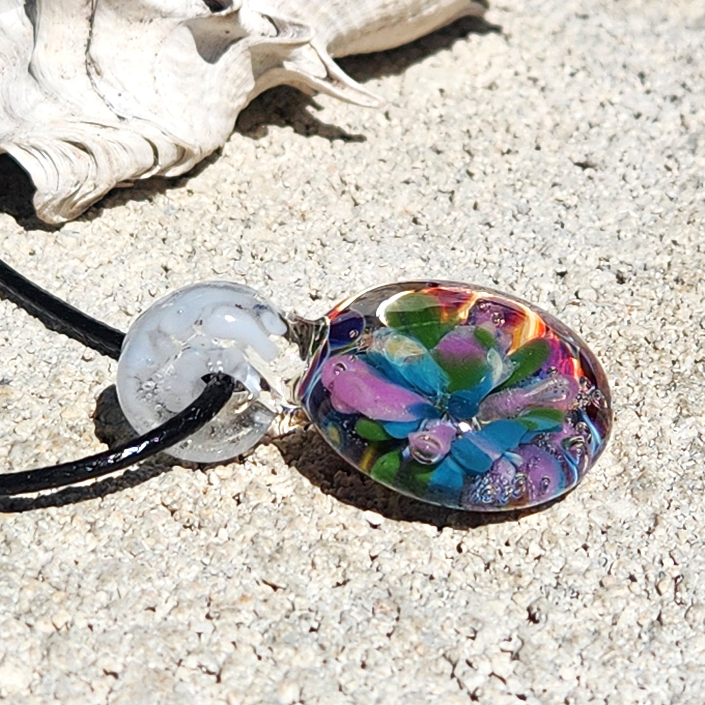 Unique purple glass pendant on black cord, artistic details